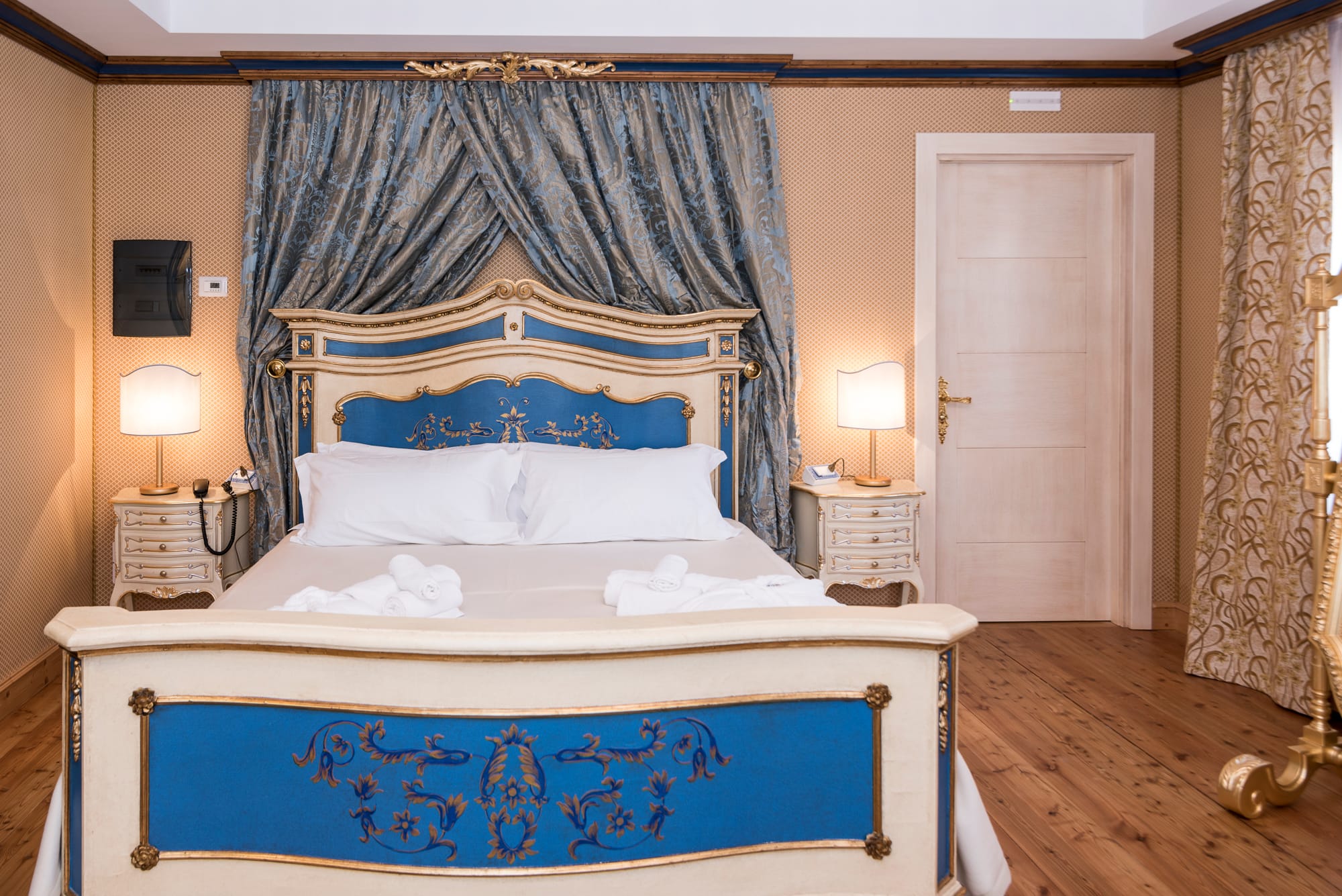 a bed with a blue and white cover