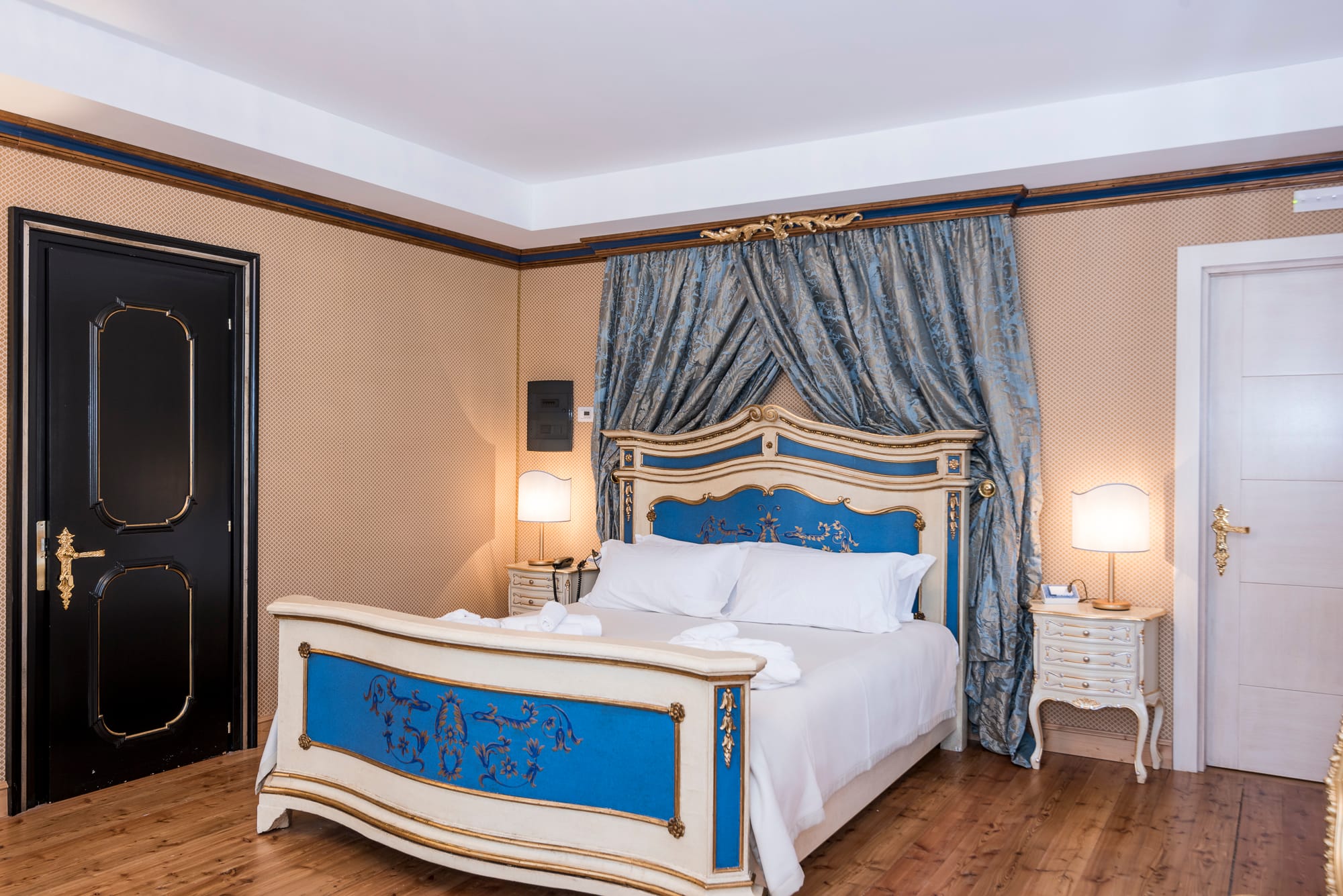 a bed with a blue curtain