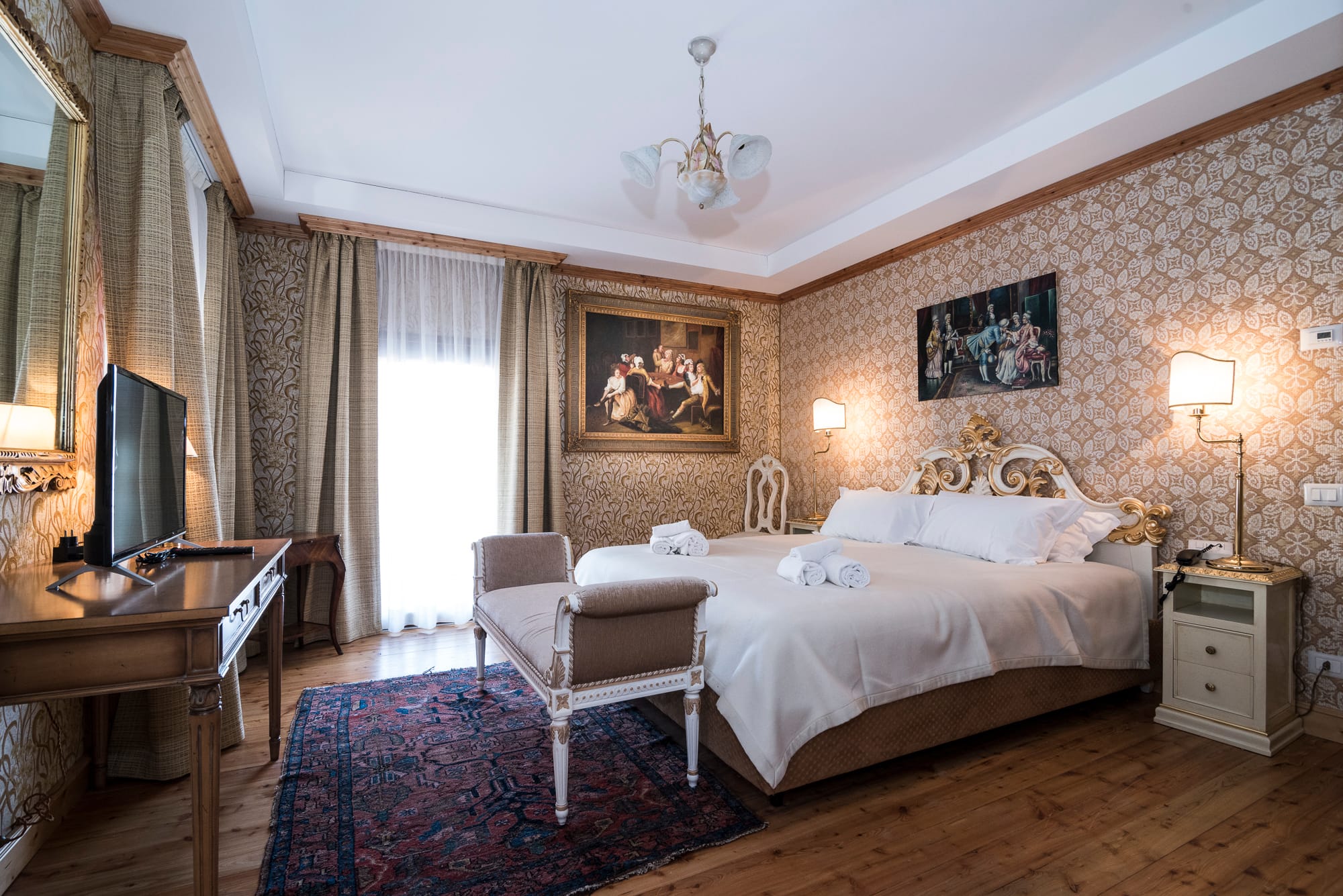 a bedroom with a bed and a chair