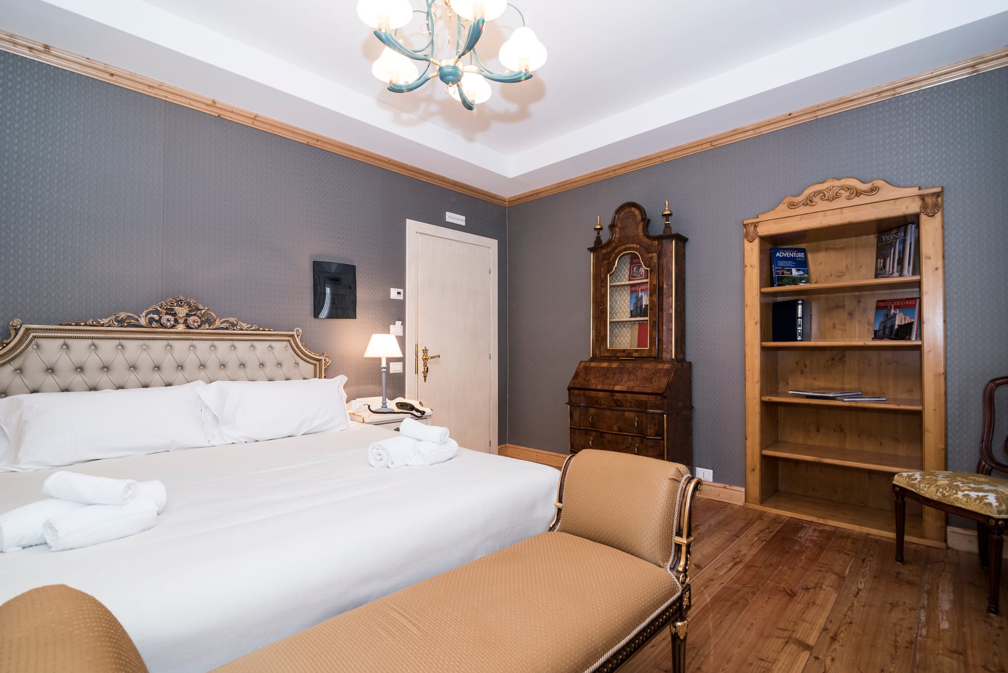 a bedroom with a bed and a bookcase