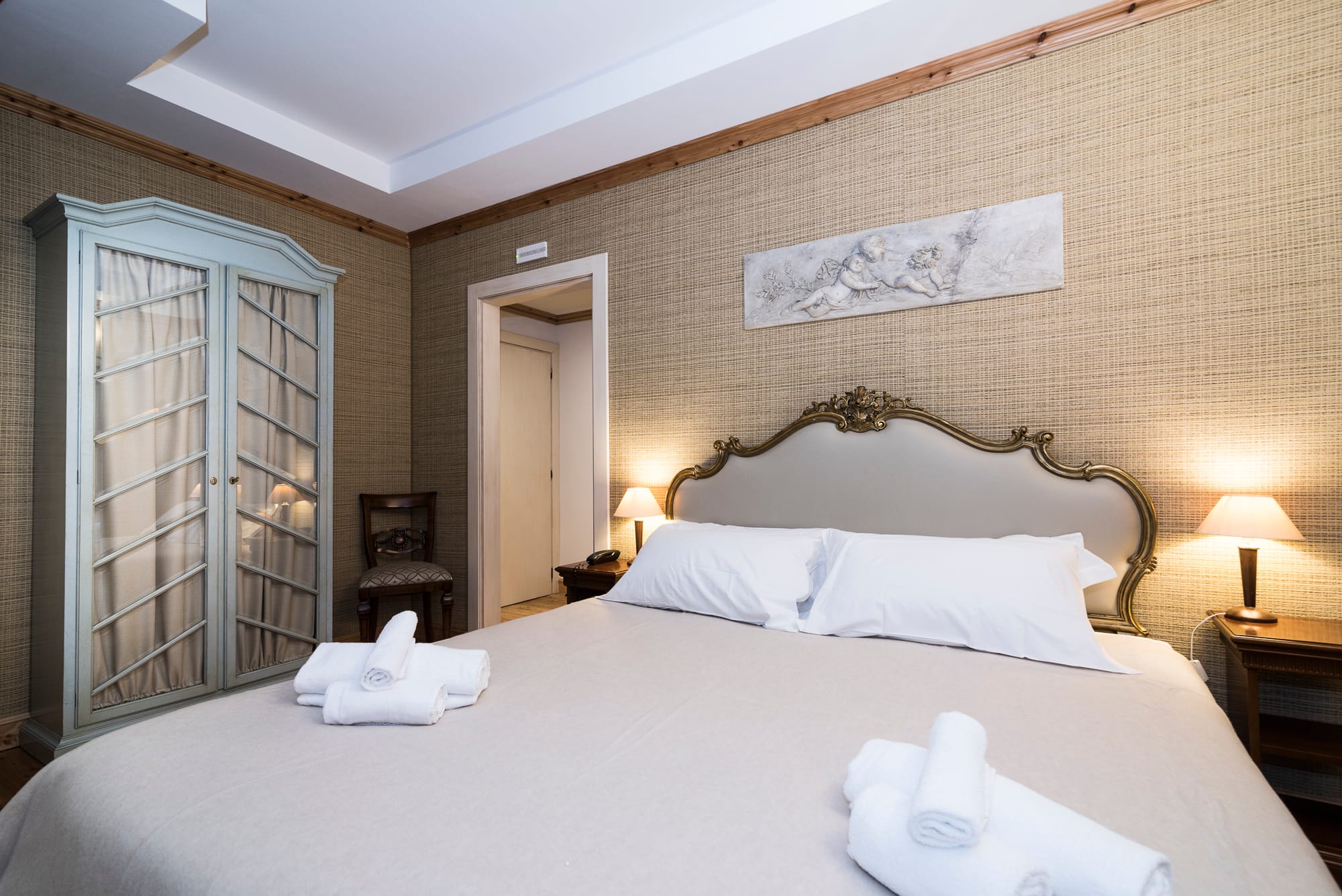 a hotel room with a bed and a table