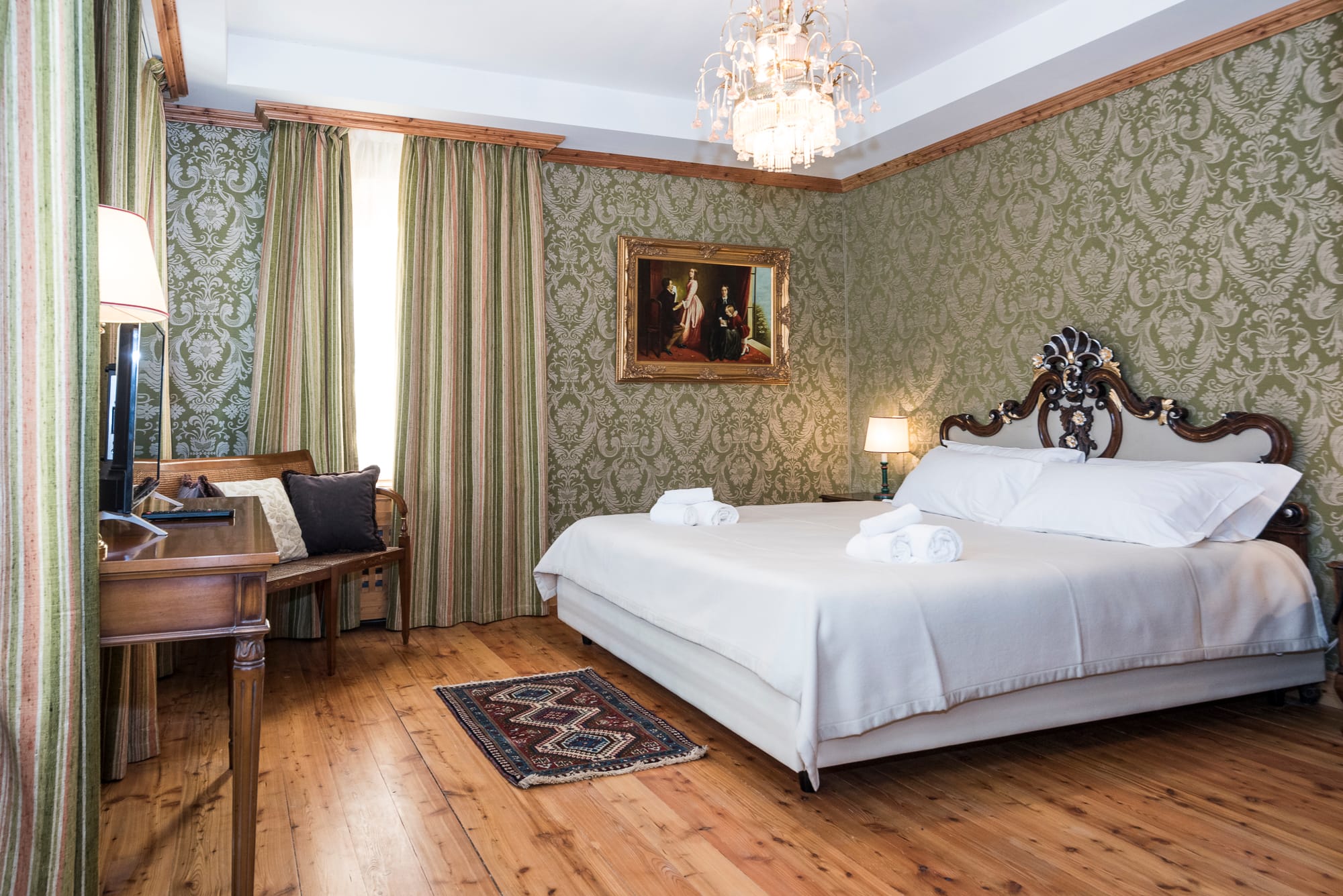 a bedroom with a bed and a desk