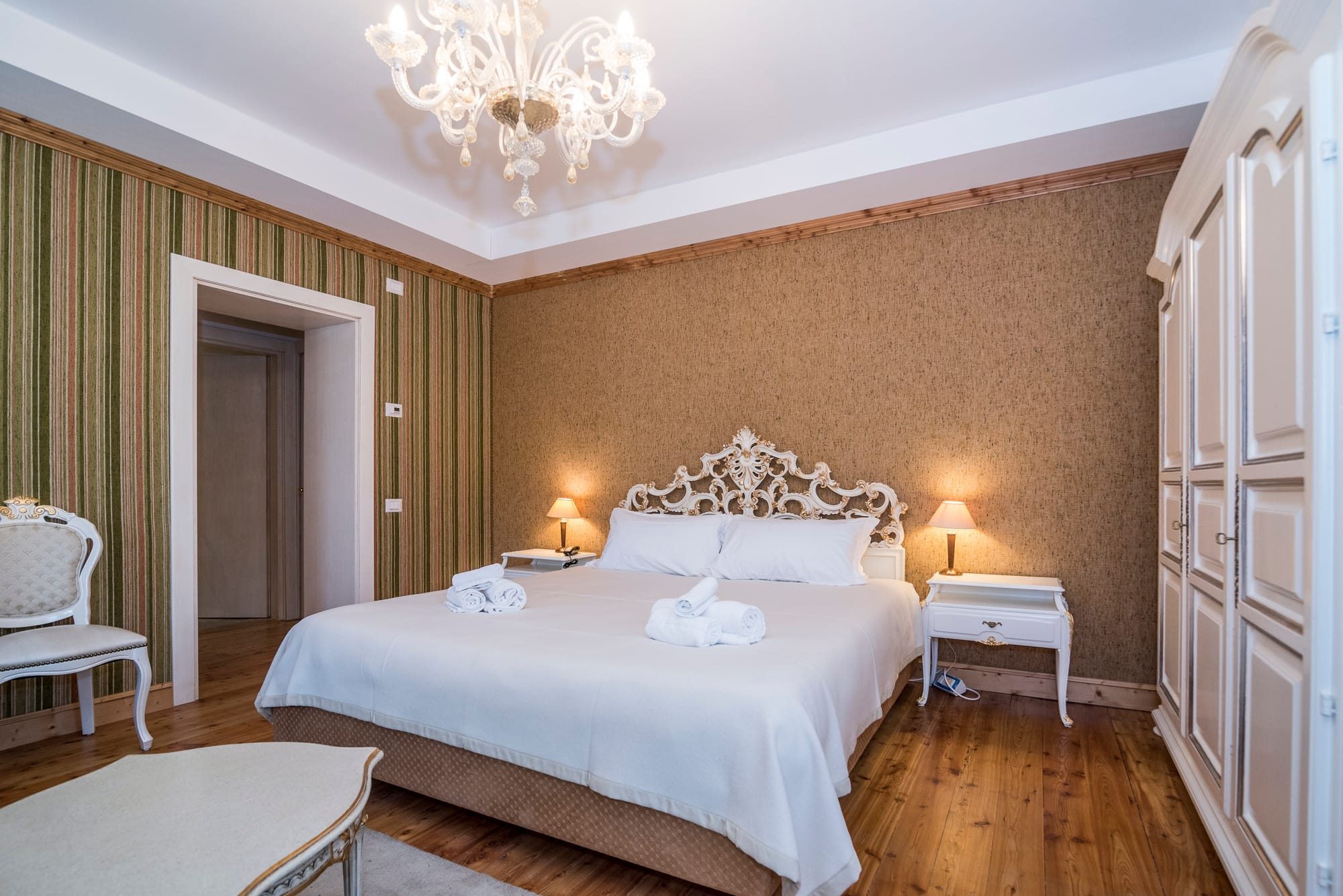 a bedroom with a bed and a table