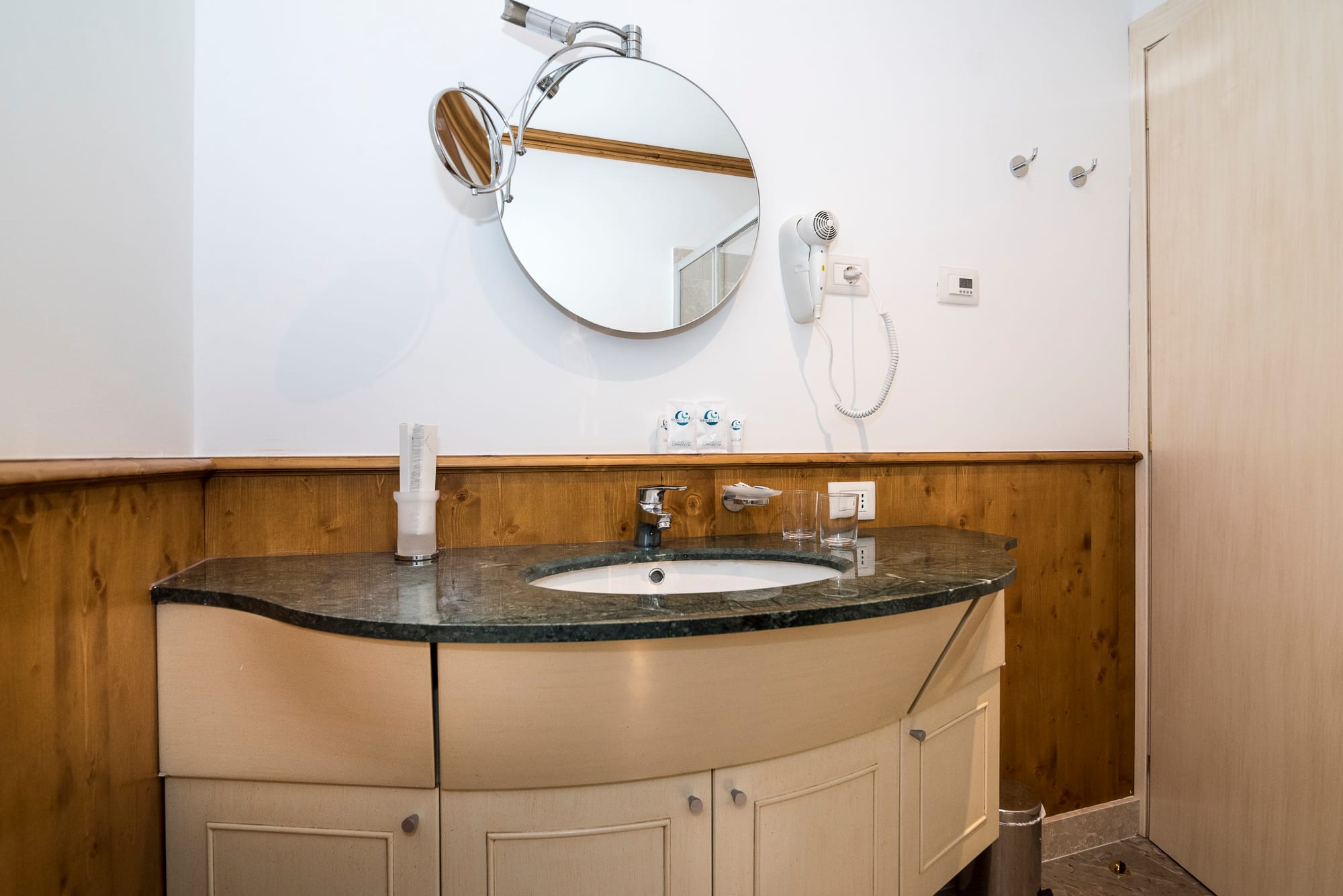 a bathroom with a large mirror