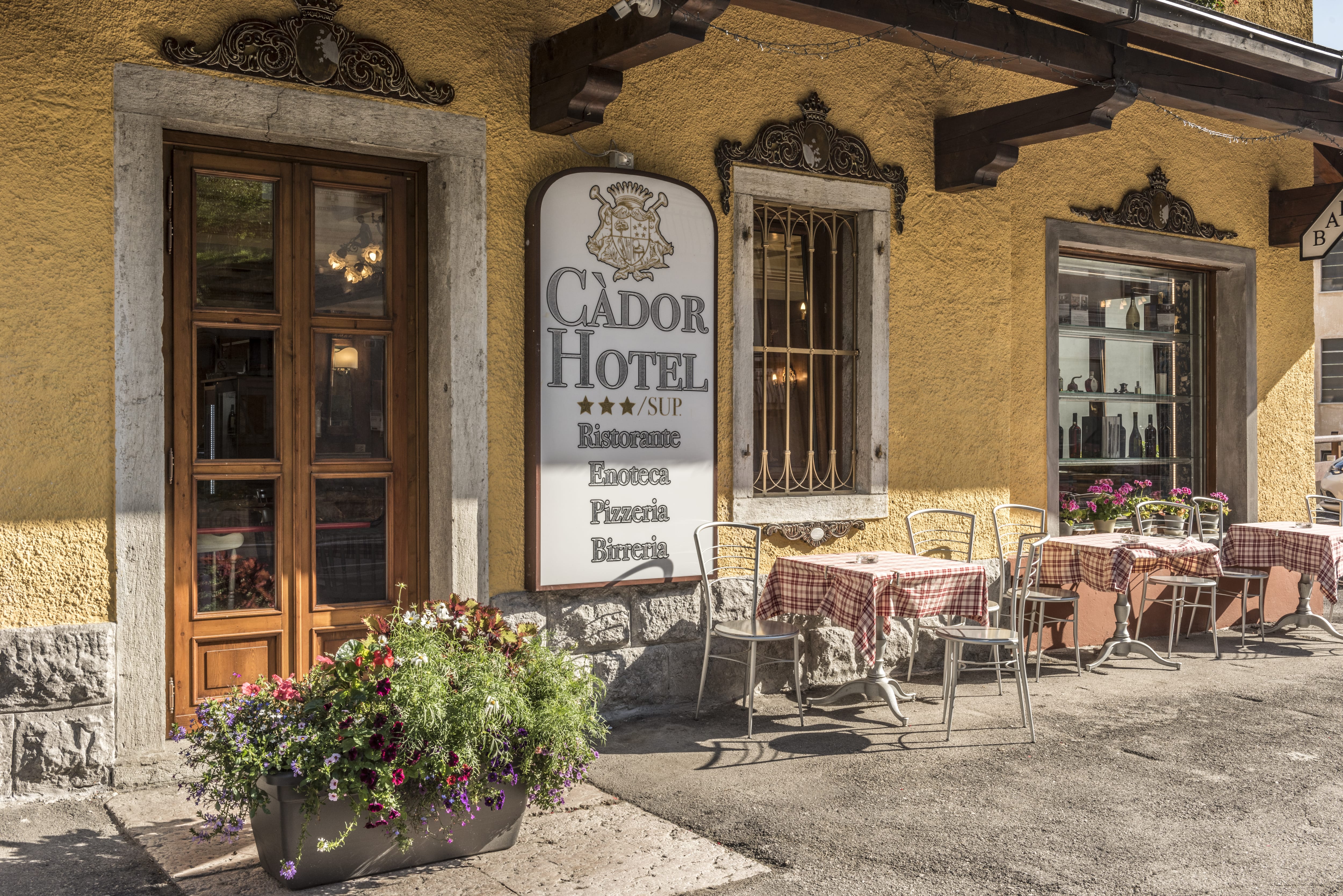 a restaurant with tables and chairs outside