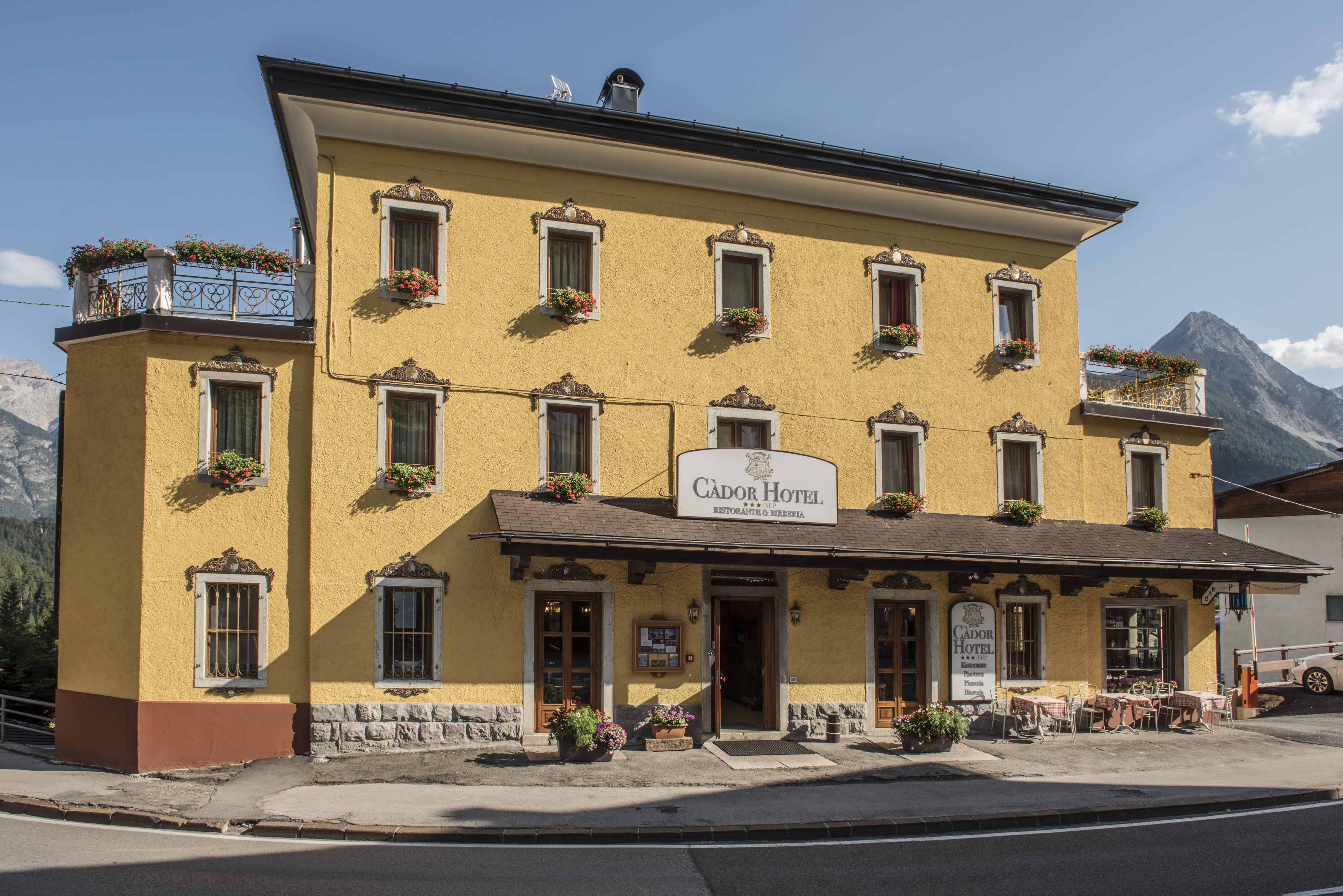 a yellow building with a sign
