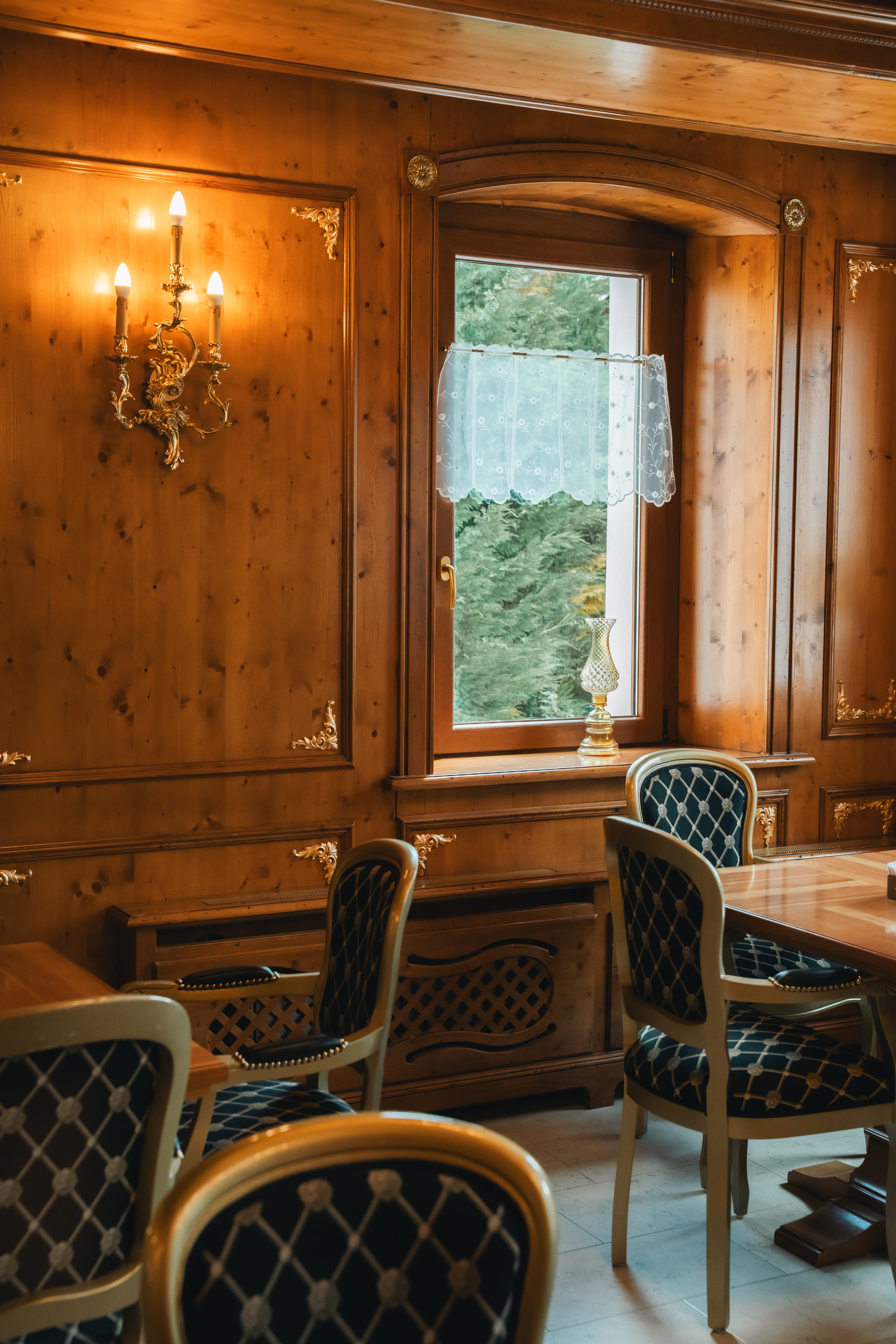 a room with a window and chairs