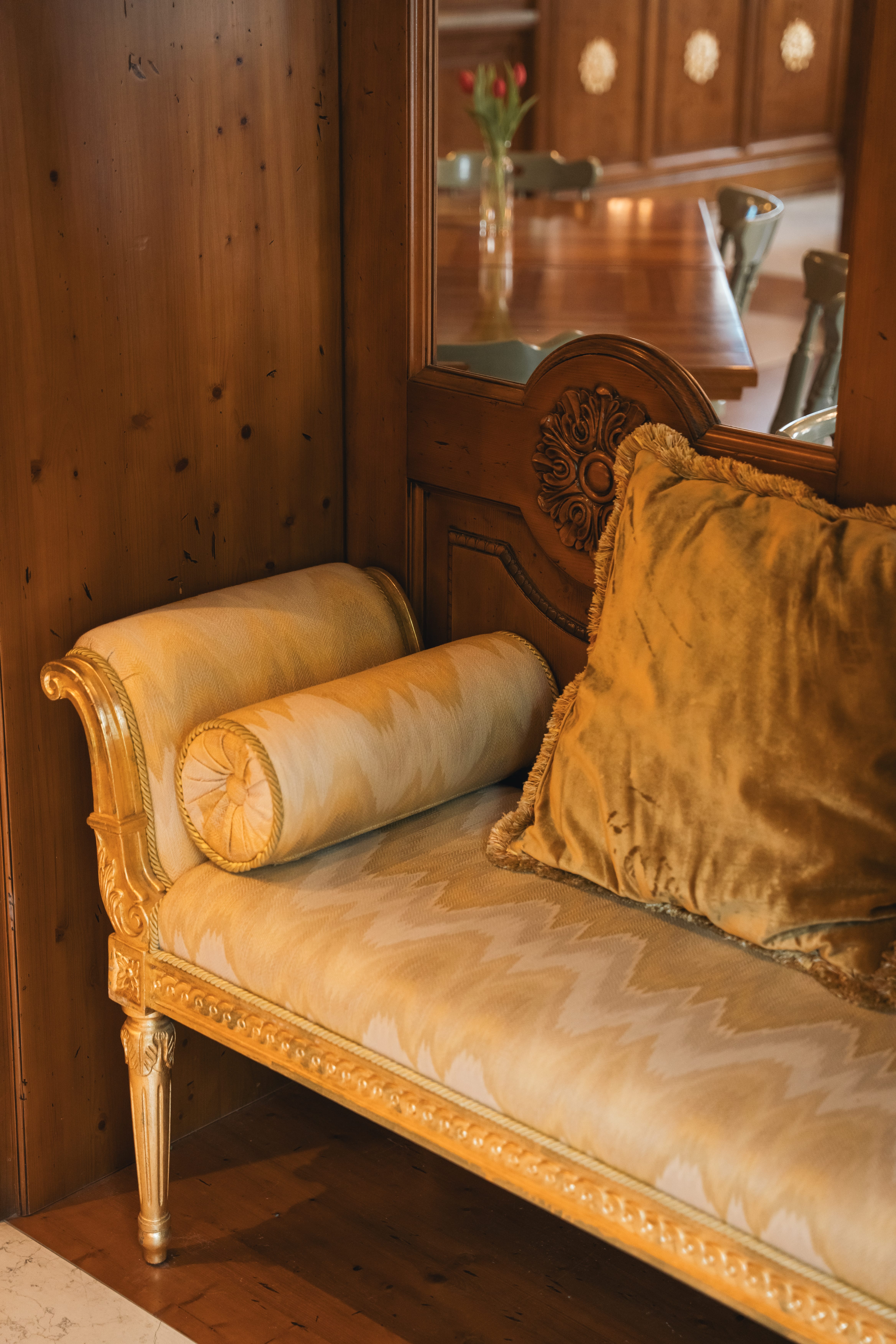 a couch with pillows in a room