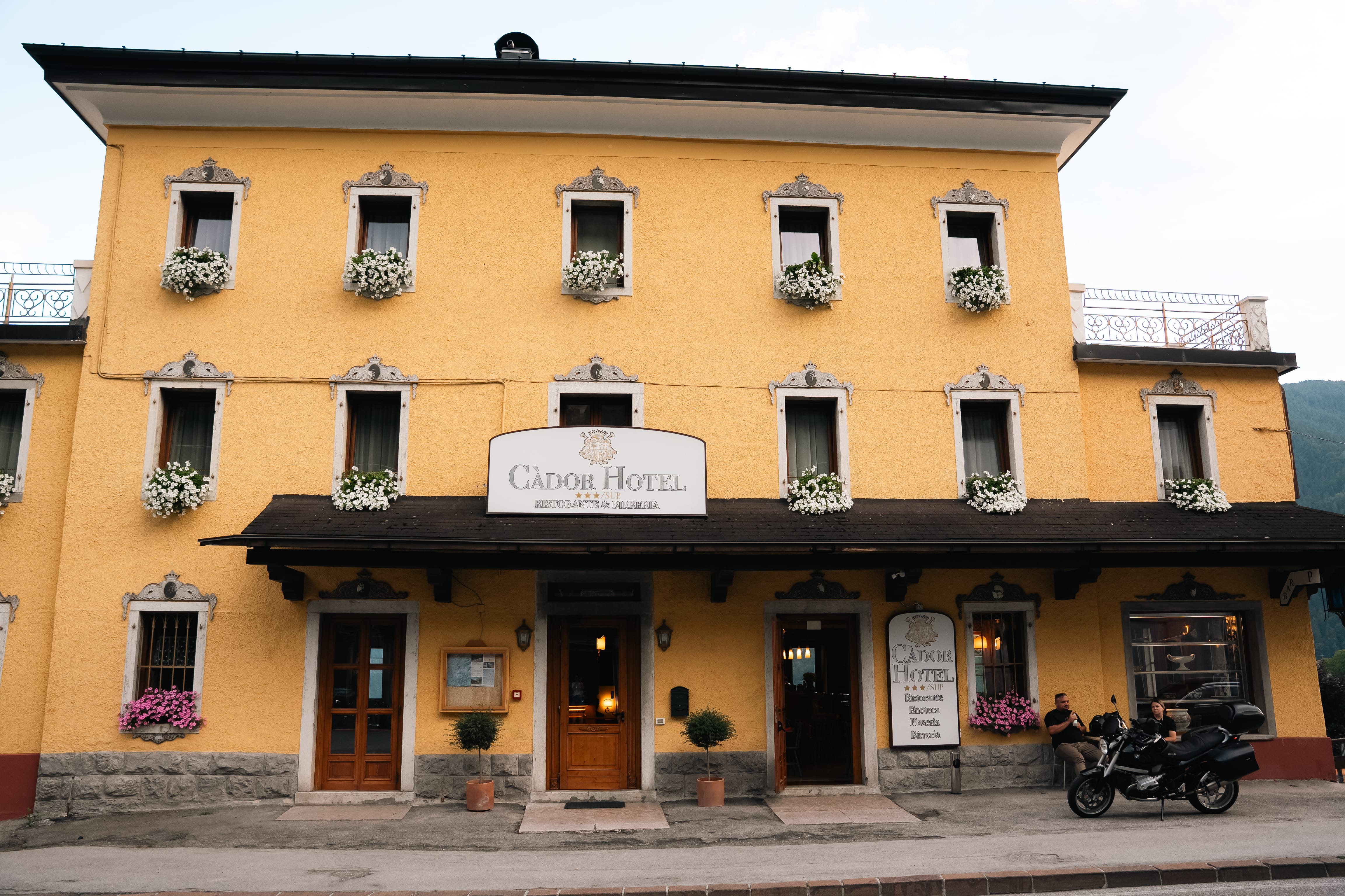 a yellow building with a sign on the front