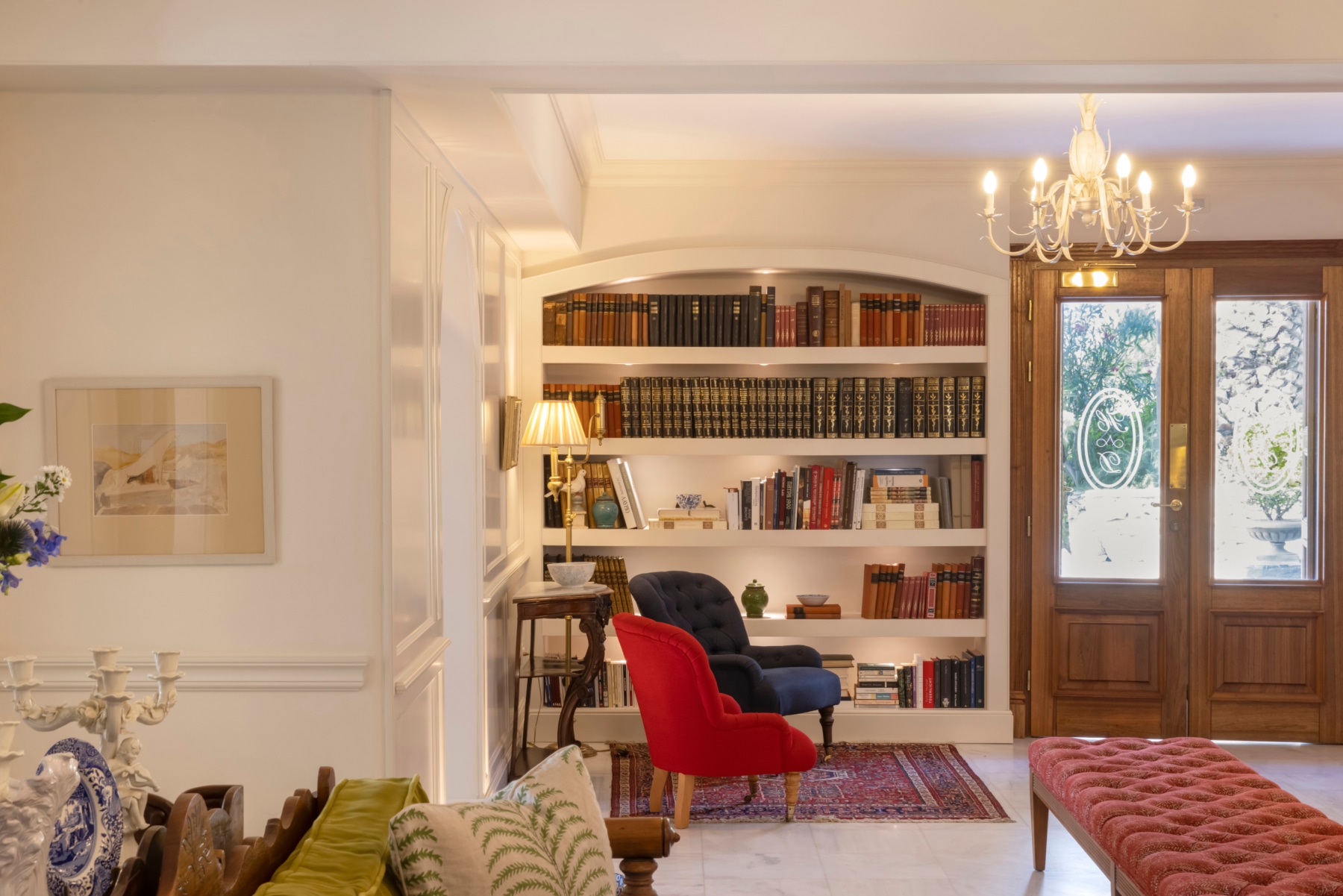 a room with a bookcase and a chair