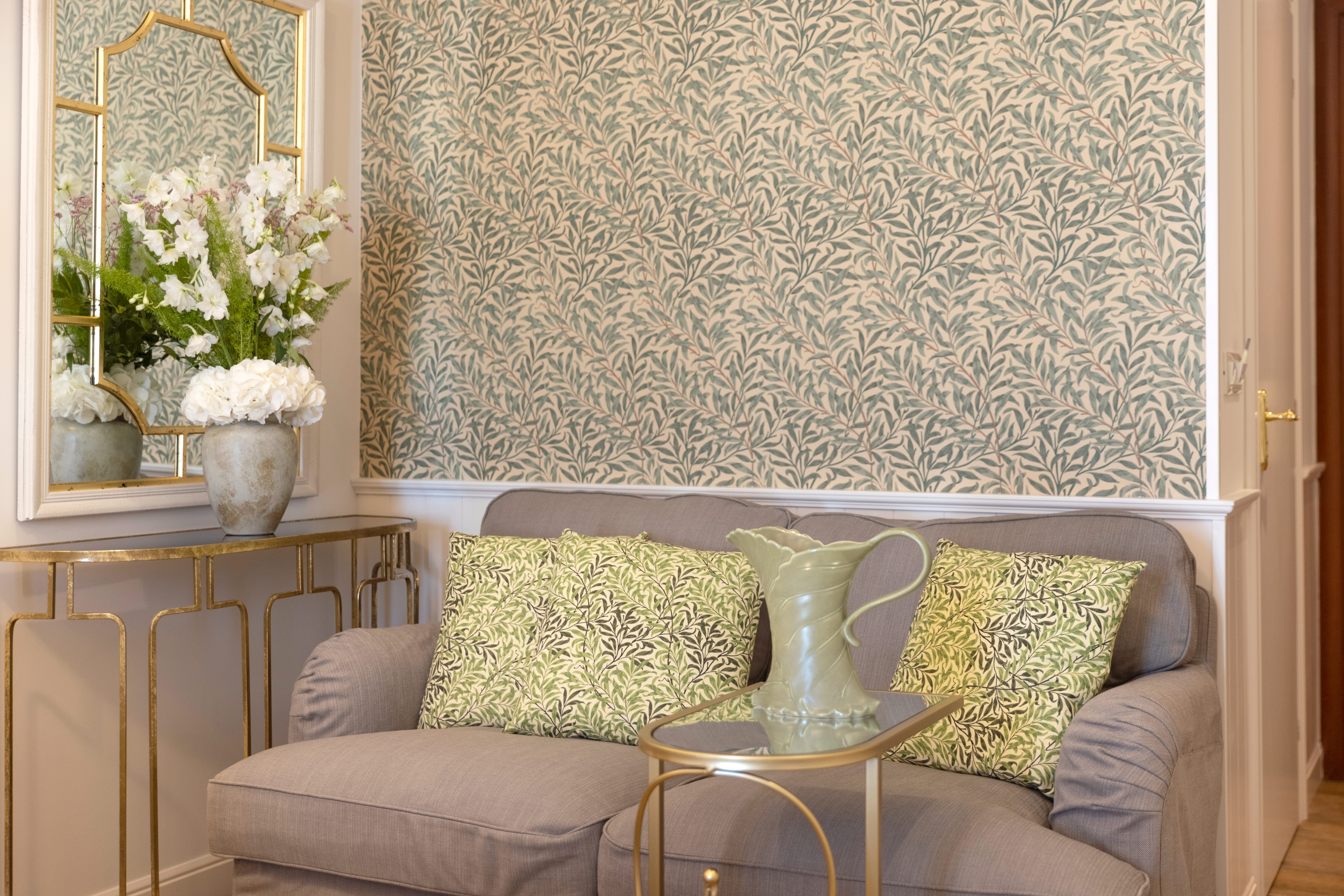 a living room with a green couch