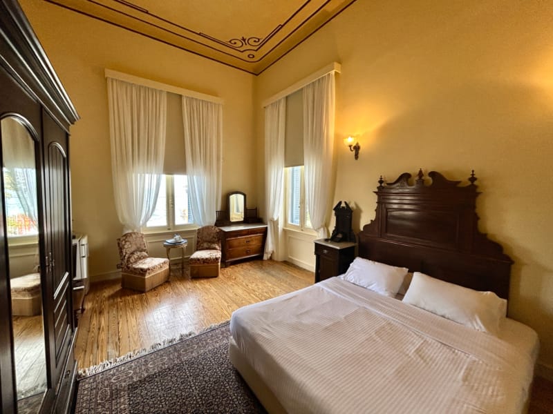 a bedroom with a bed and a chair