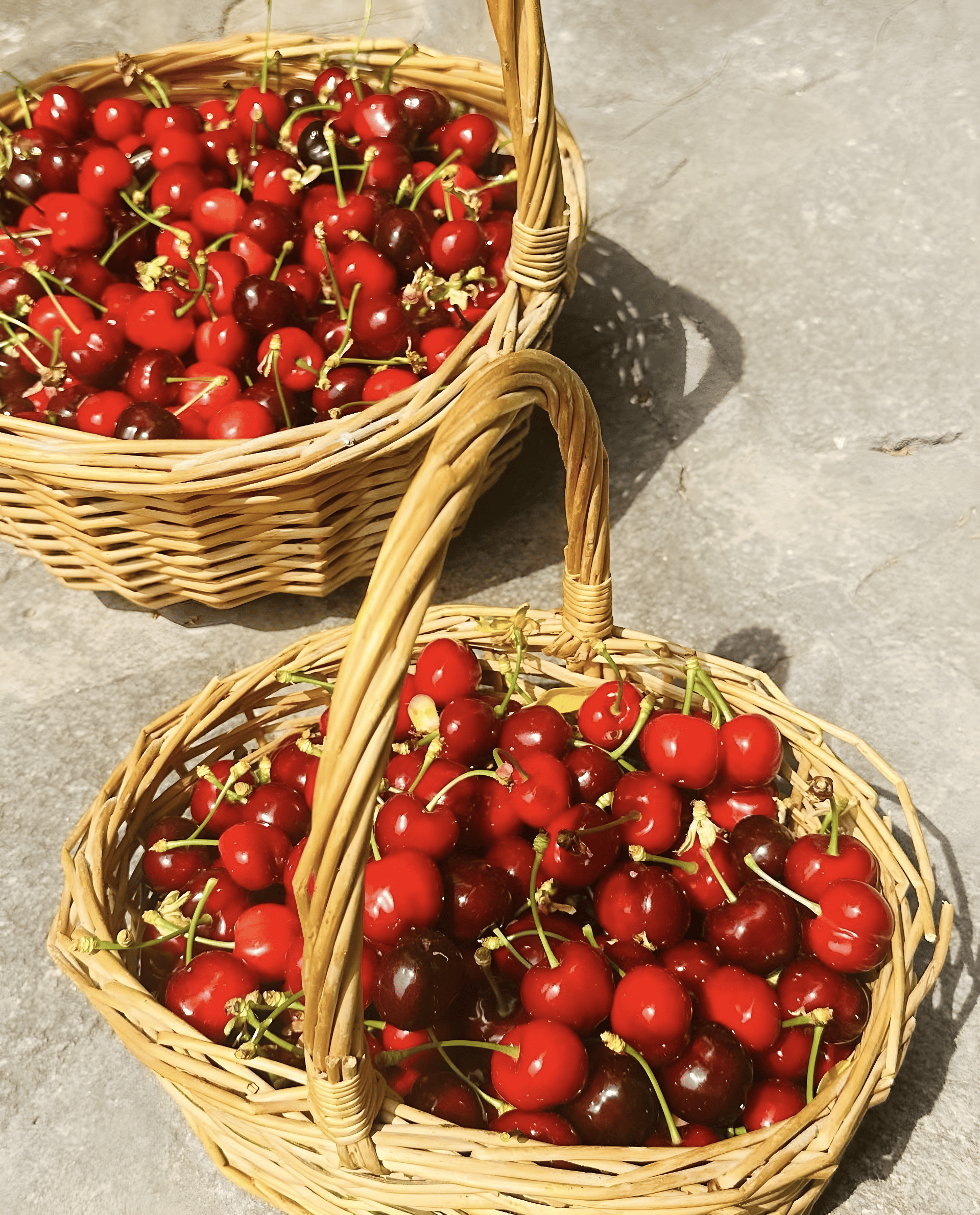 a couple of baskets full of red berries
