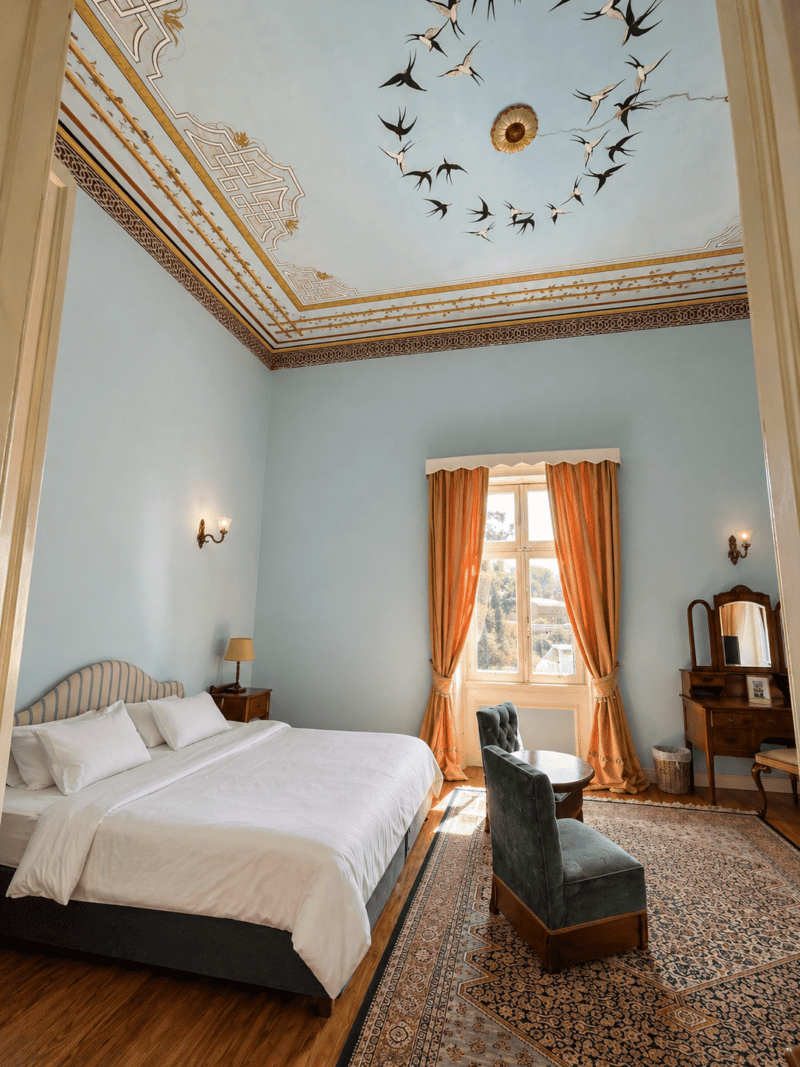 a room with a bed and a chair