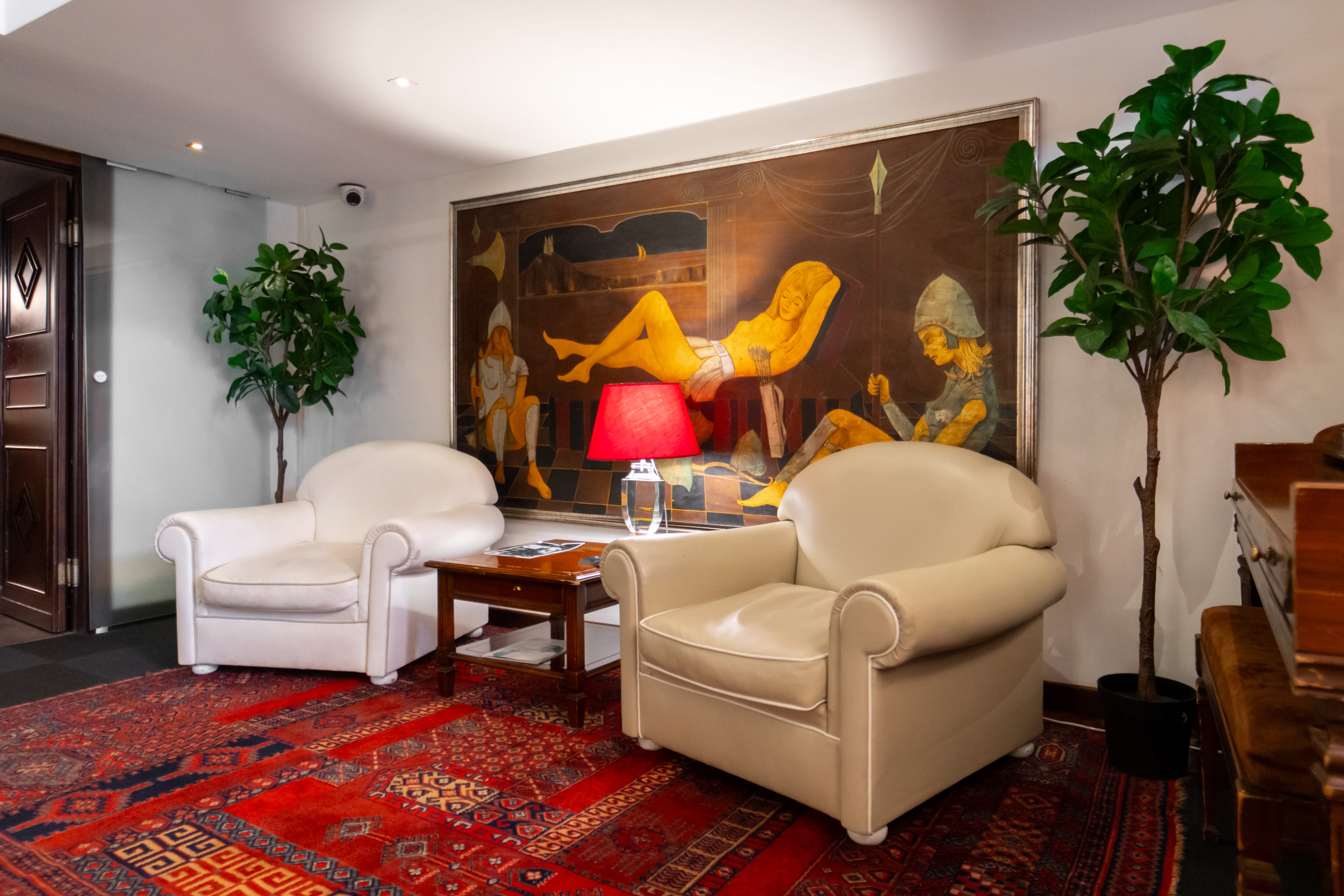 a living room with a large painting