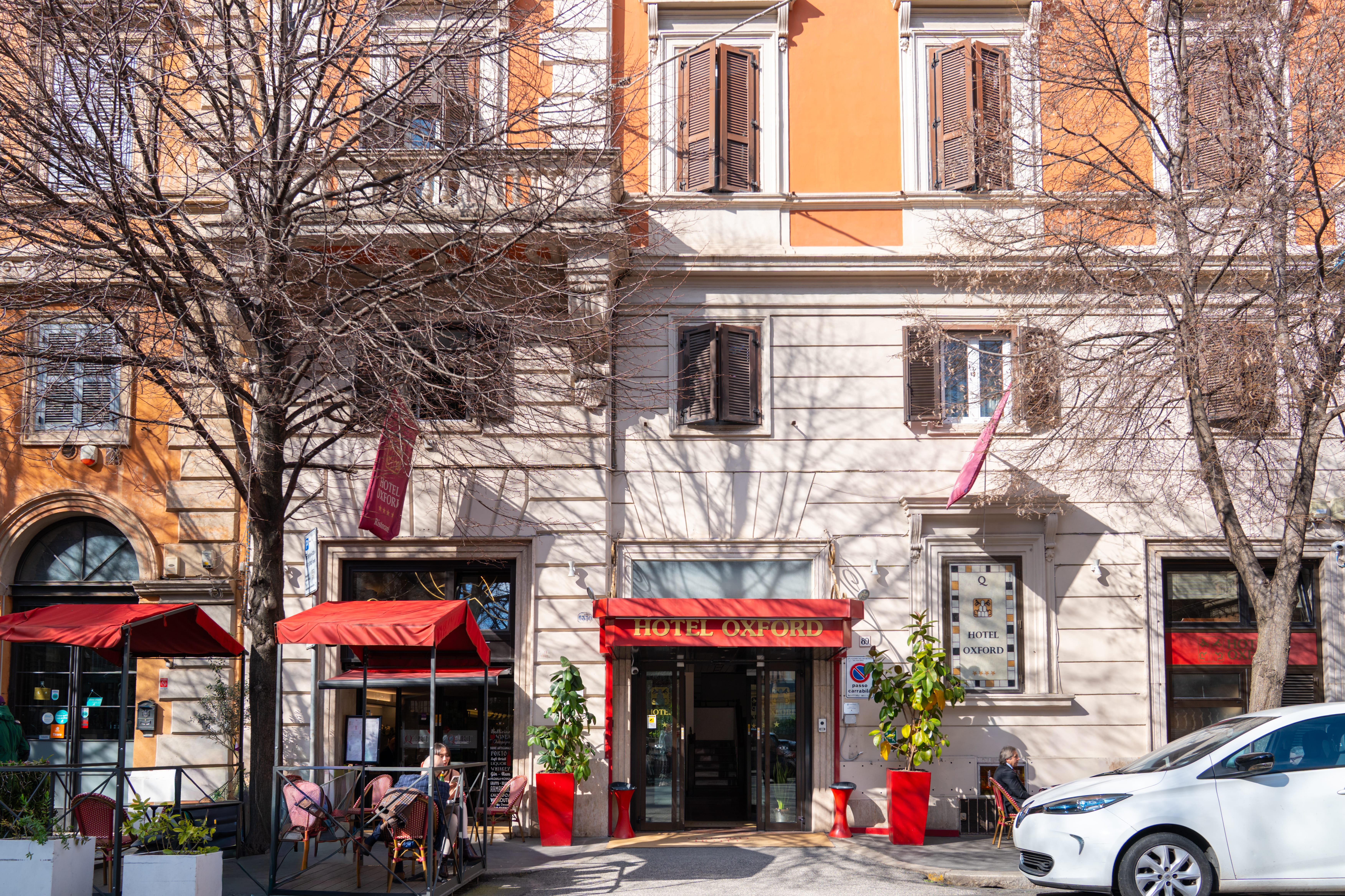 a building with a few people sitting outside