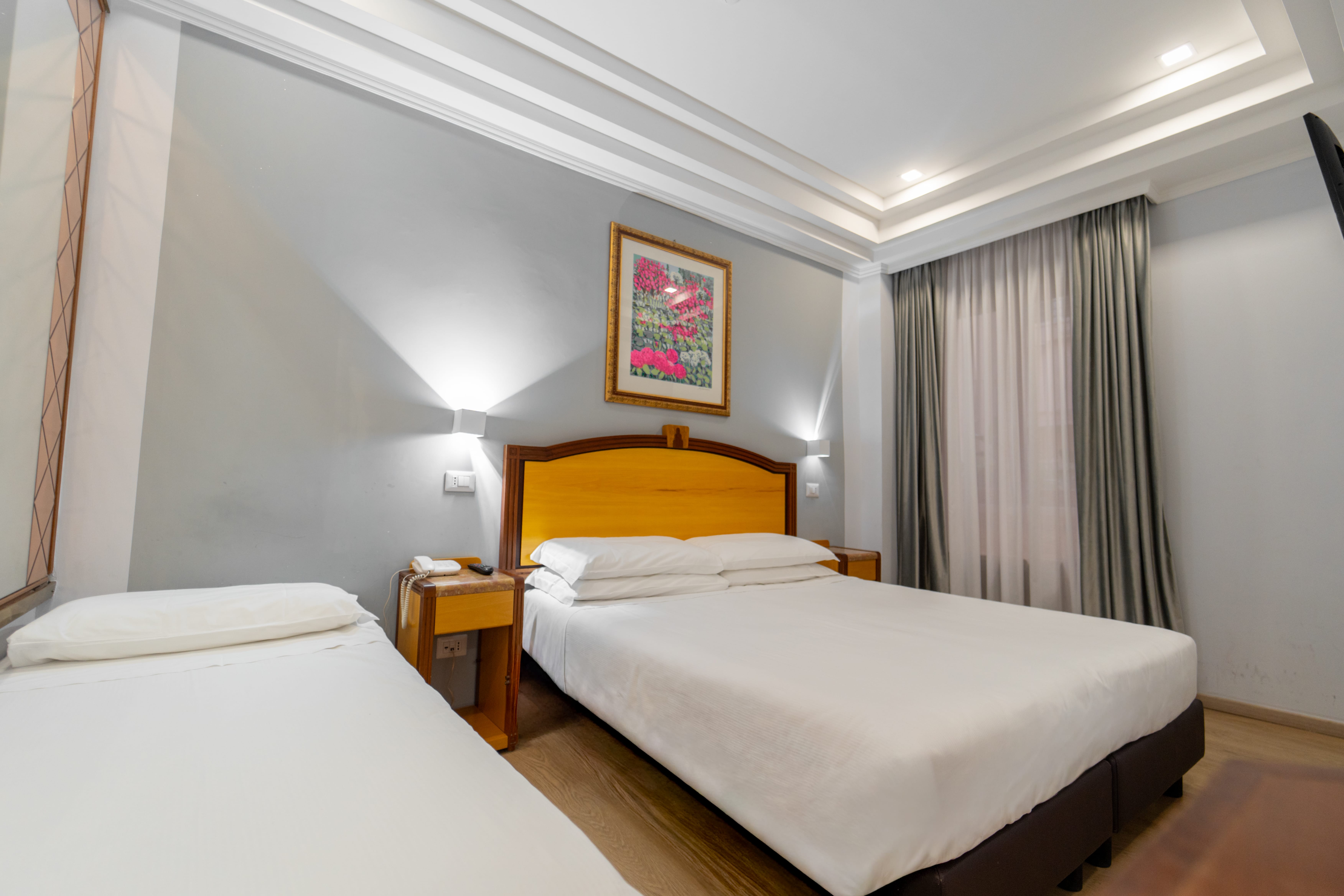 a hotel room with two beds