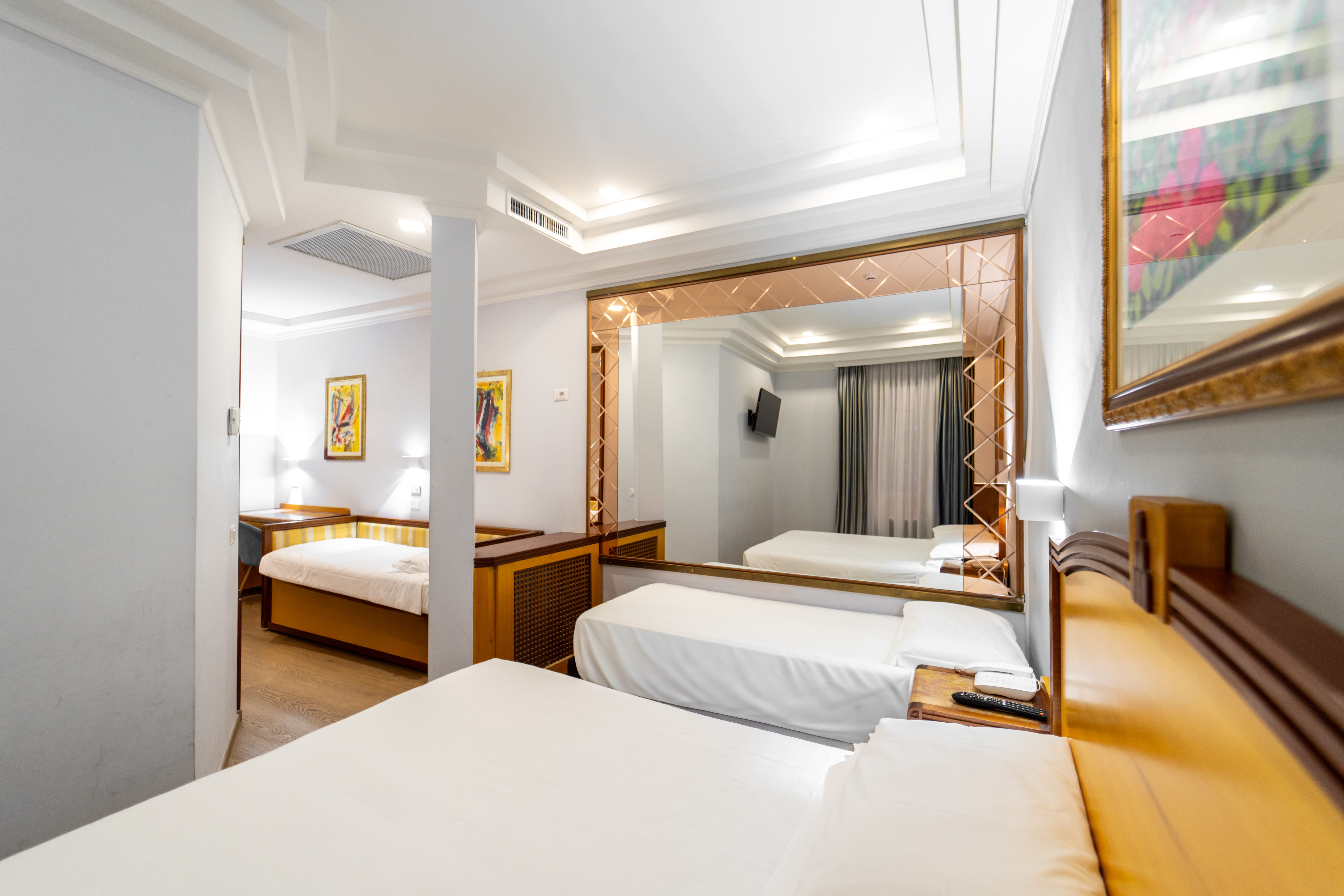 a hotel room with two beds