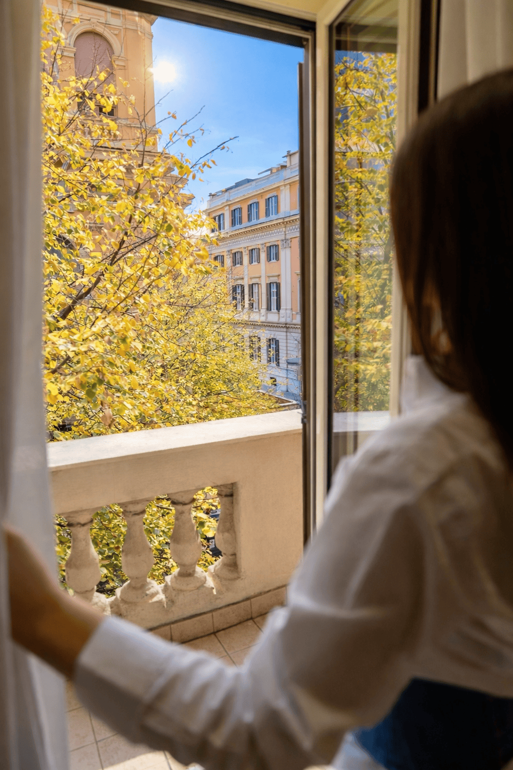 a person looking out a window