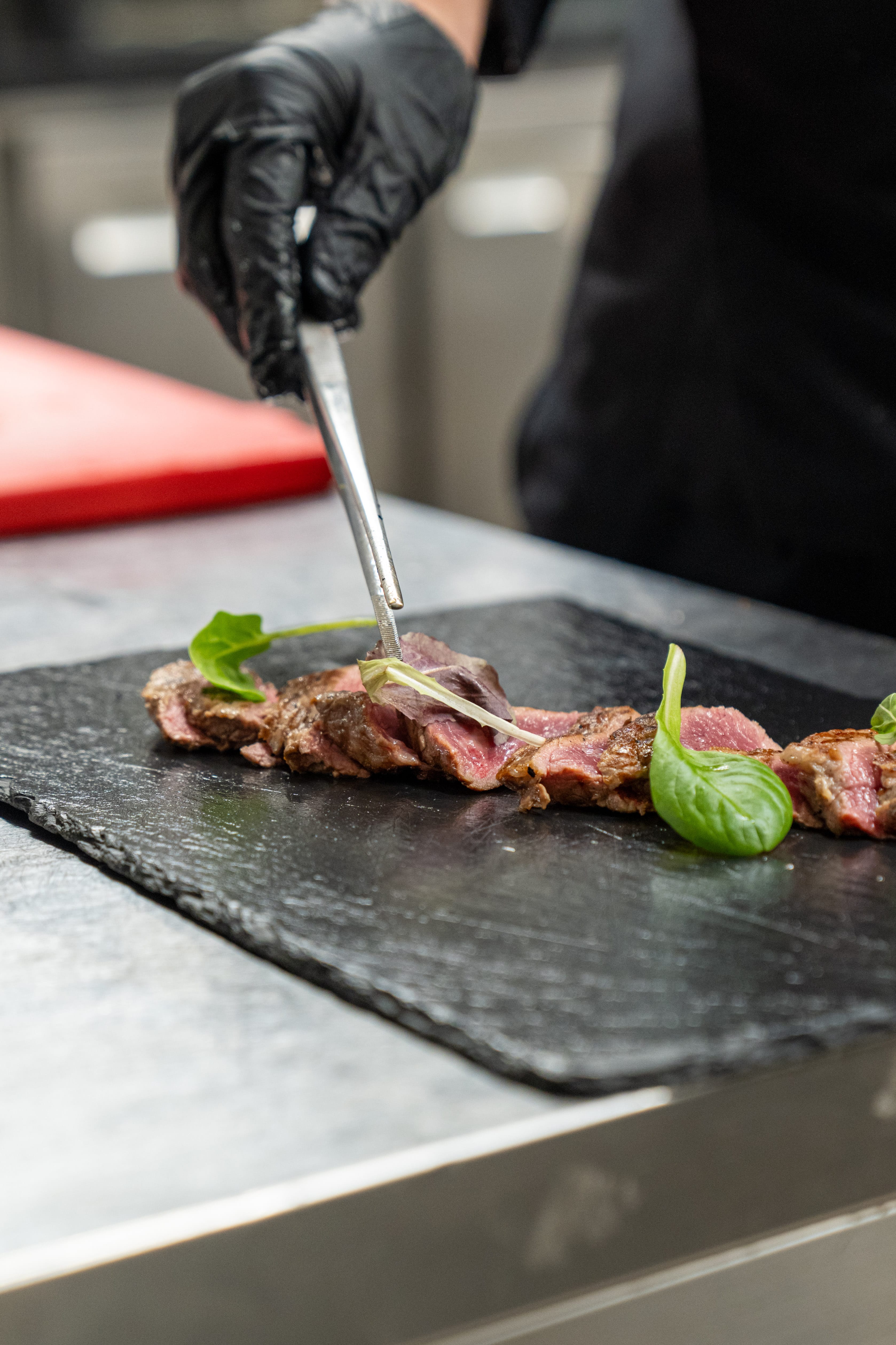 a person cutting meat with a knife