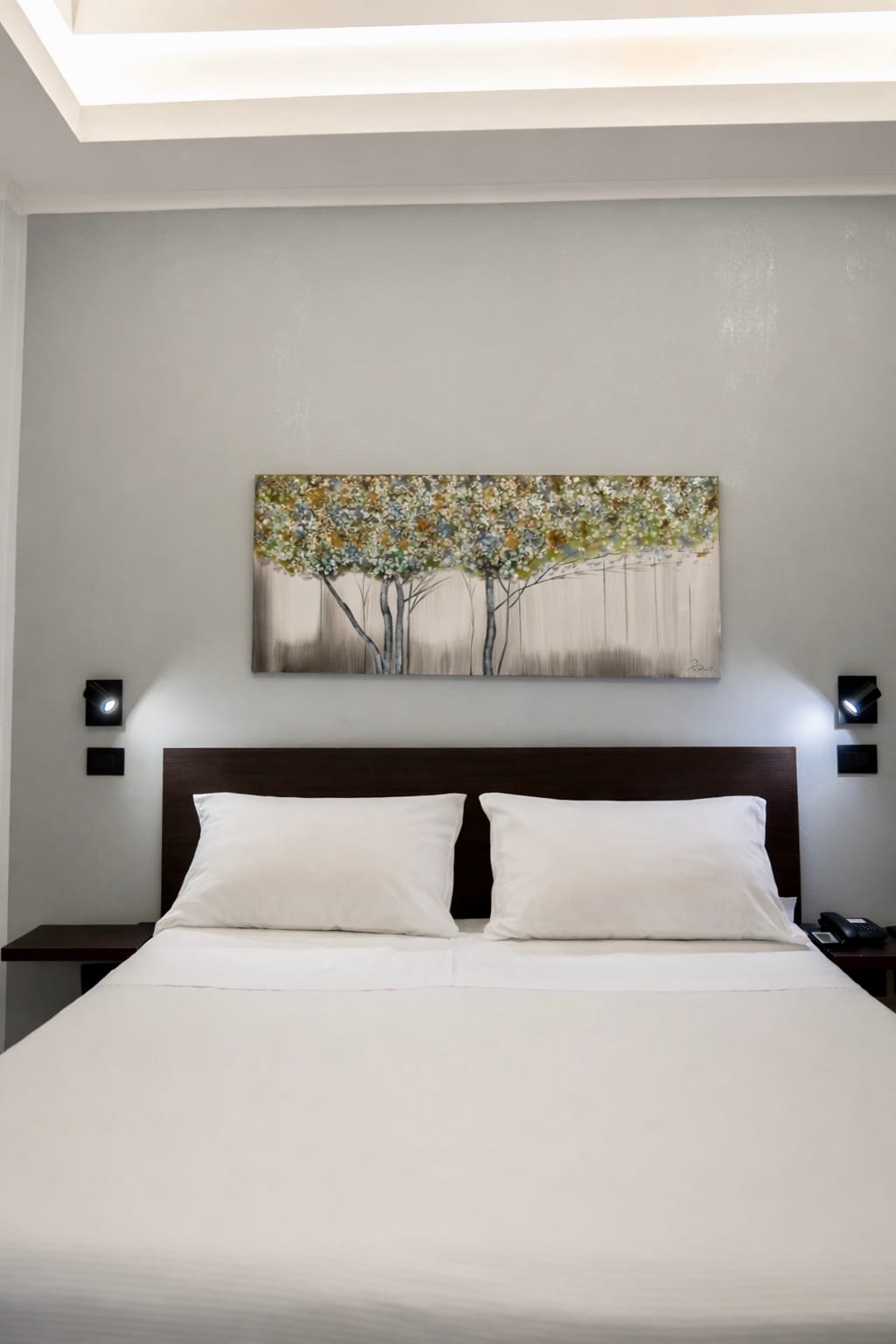 a bed with white sheets