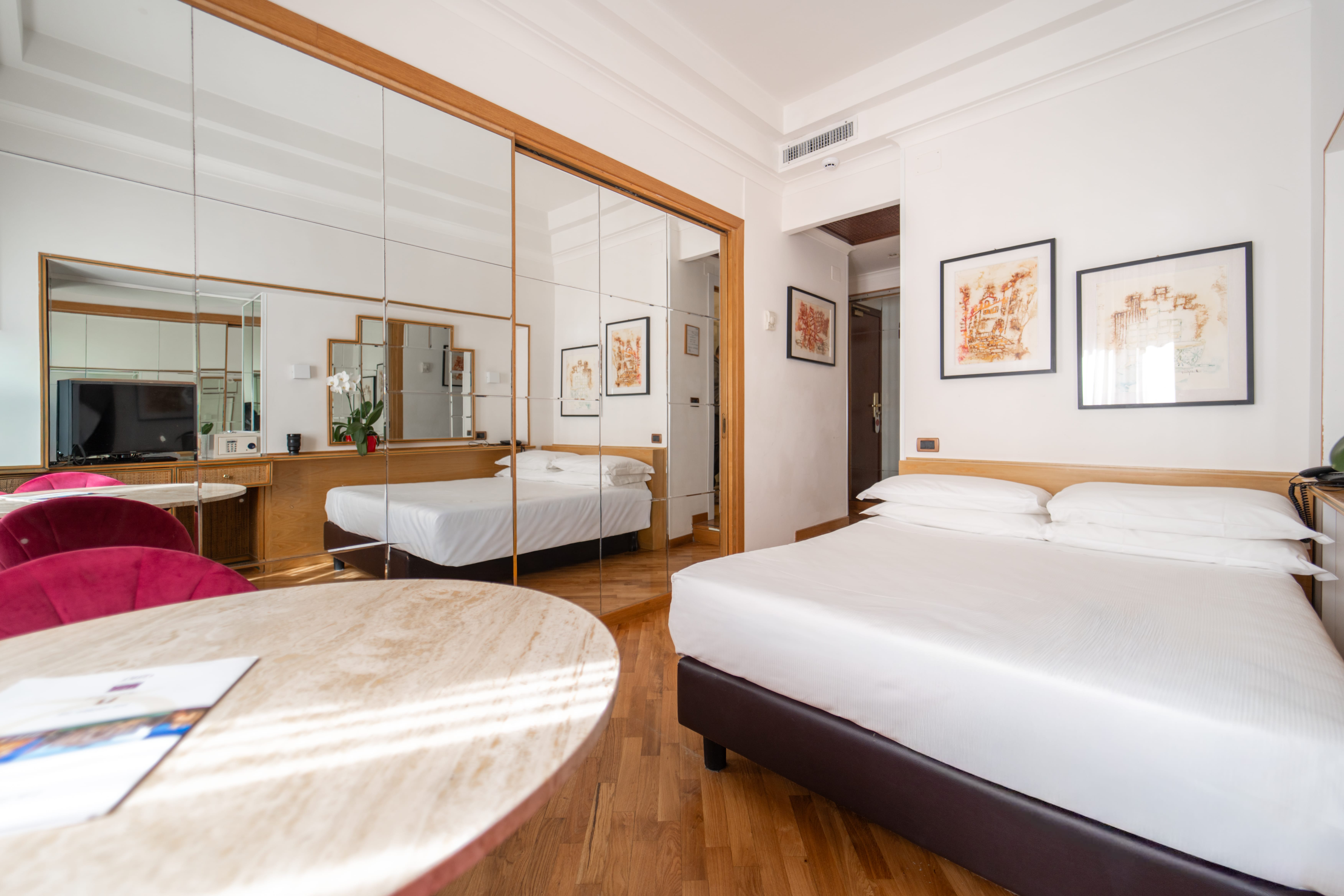 a hotel room with two beds