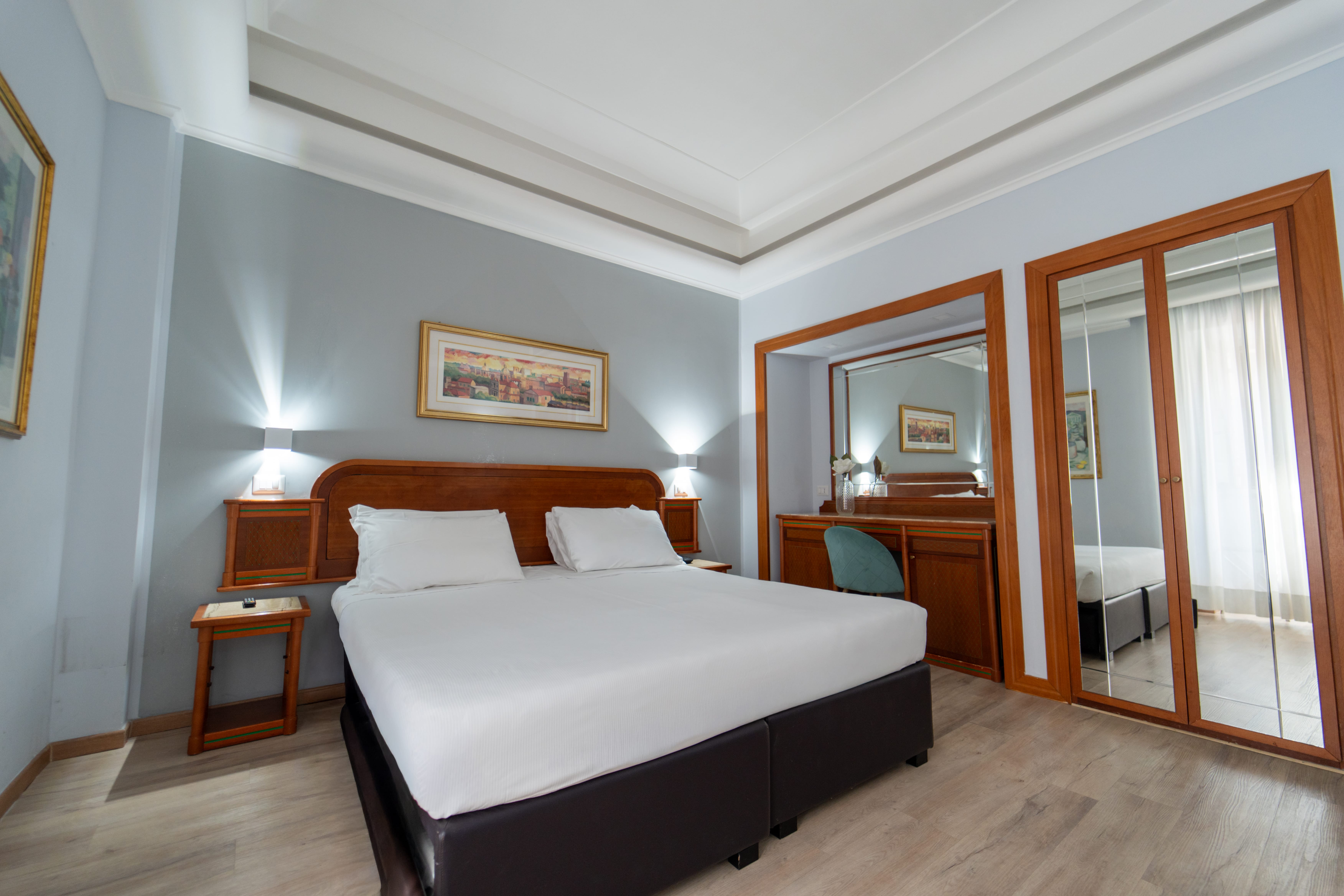 a bedroom with a bed and a desk