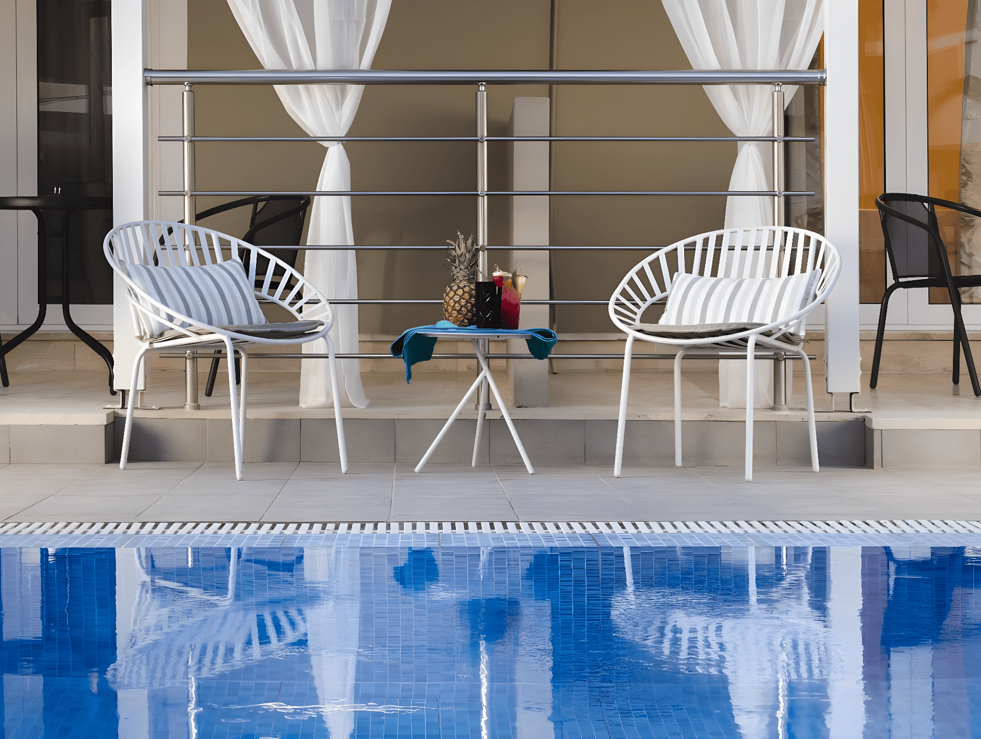 a pool with chairs around it