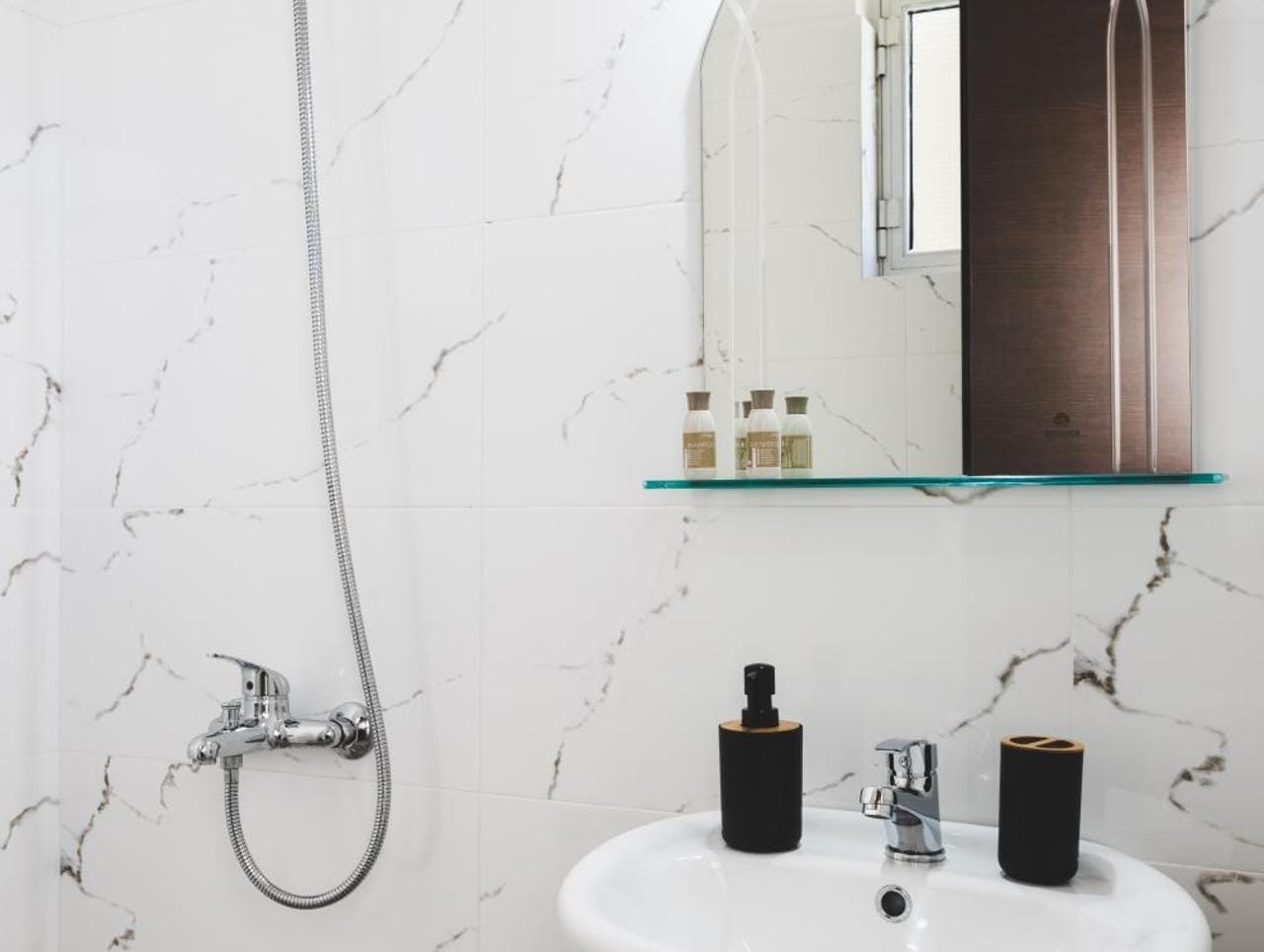 a bathroom with a sink and mirror