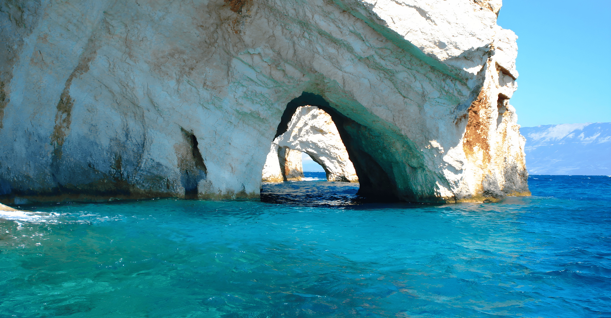 a large rock formation in the water
