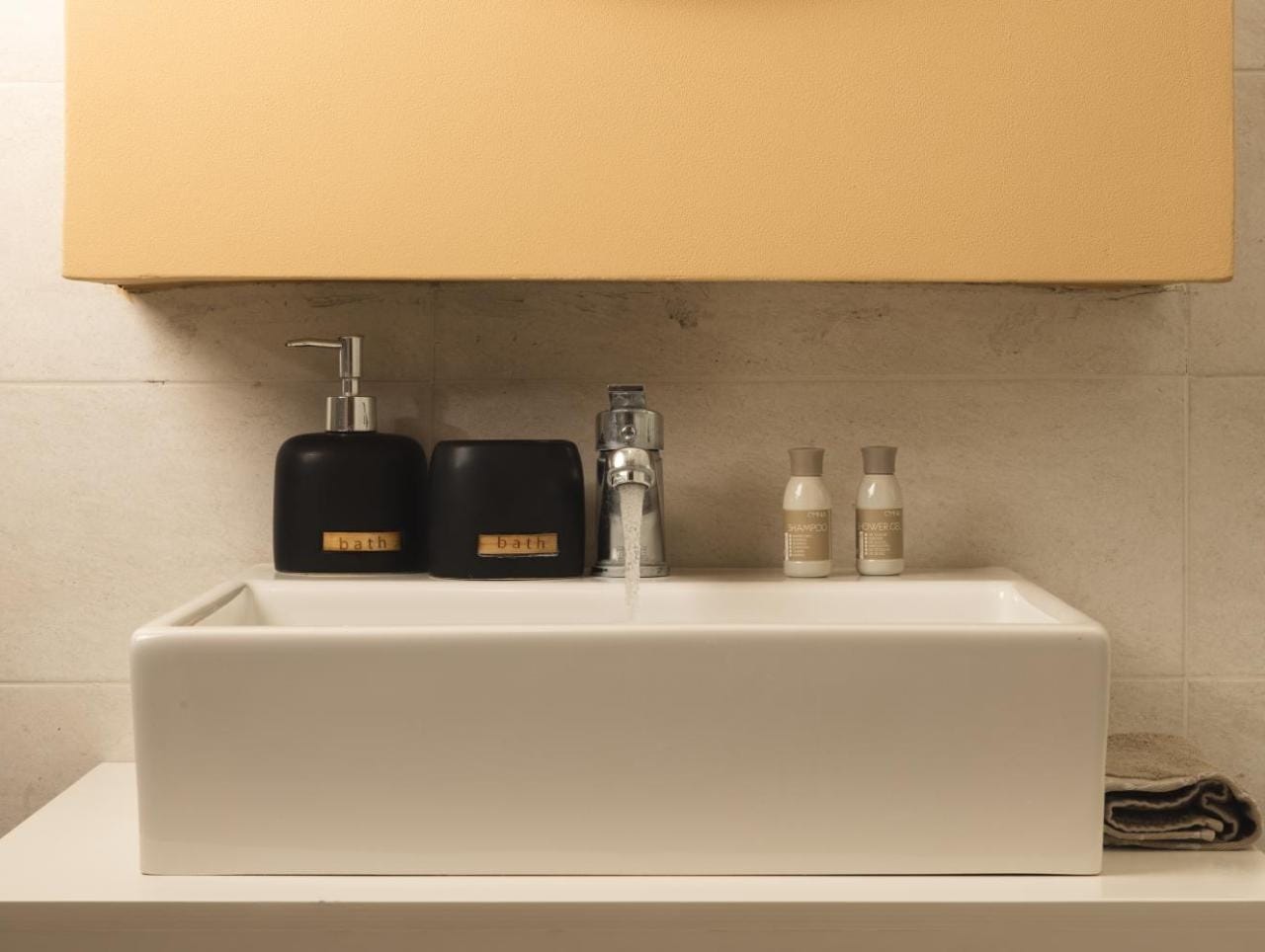 a sink with a faucet and a box on the side