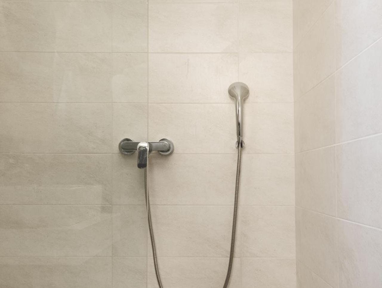 a shower head in a bathroom