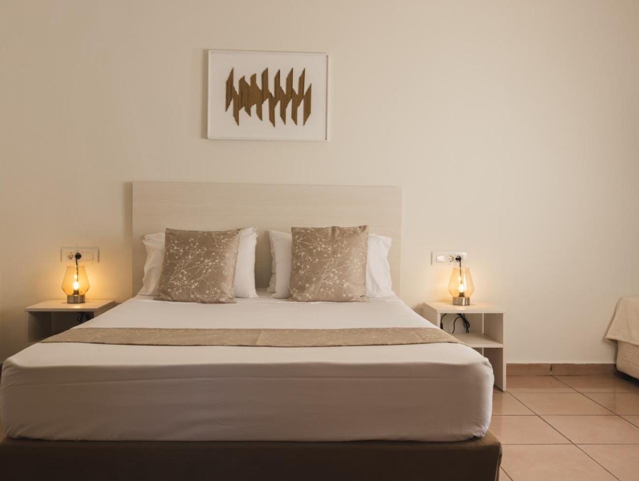 a bed with white sheets