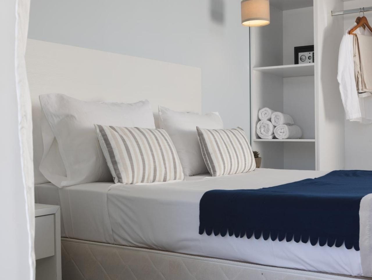 a bed with white pillows
