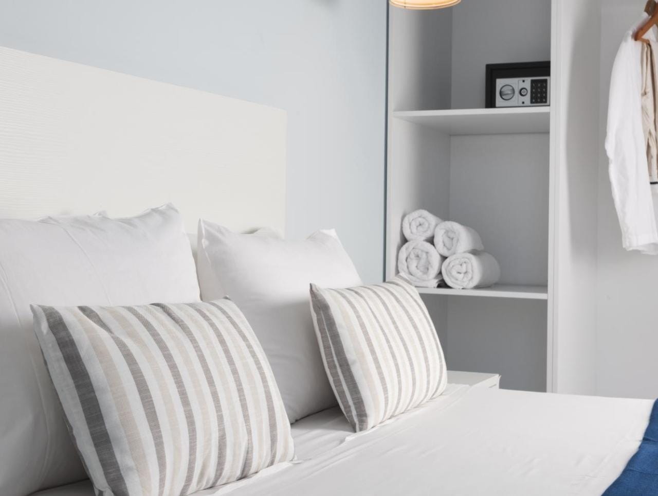 a bed with white pillows