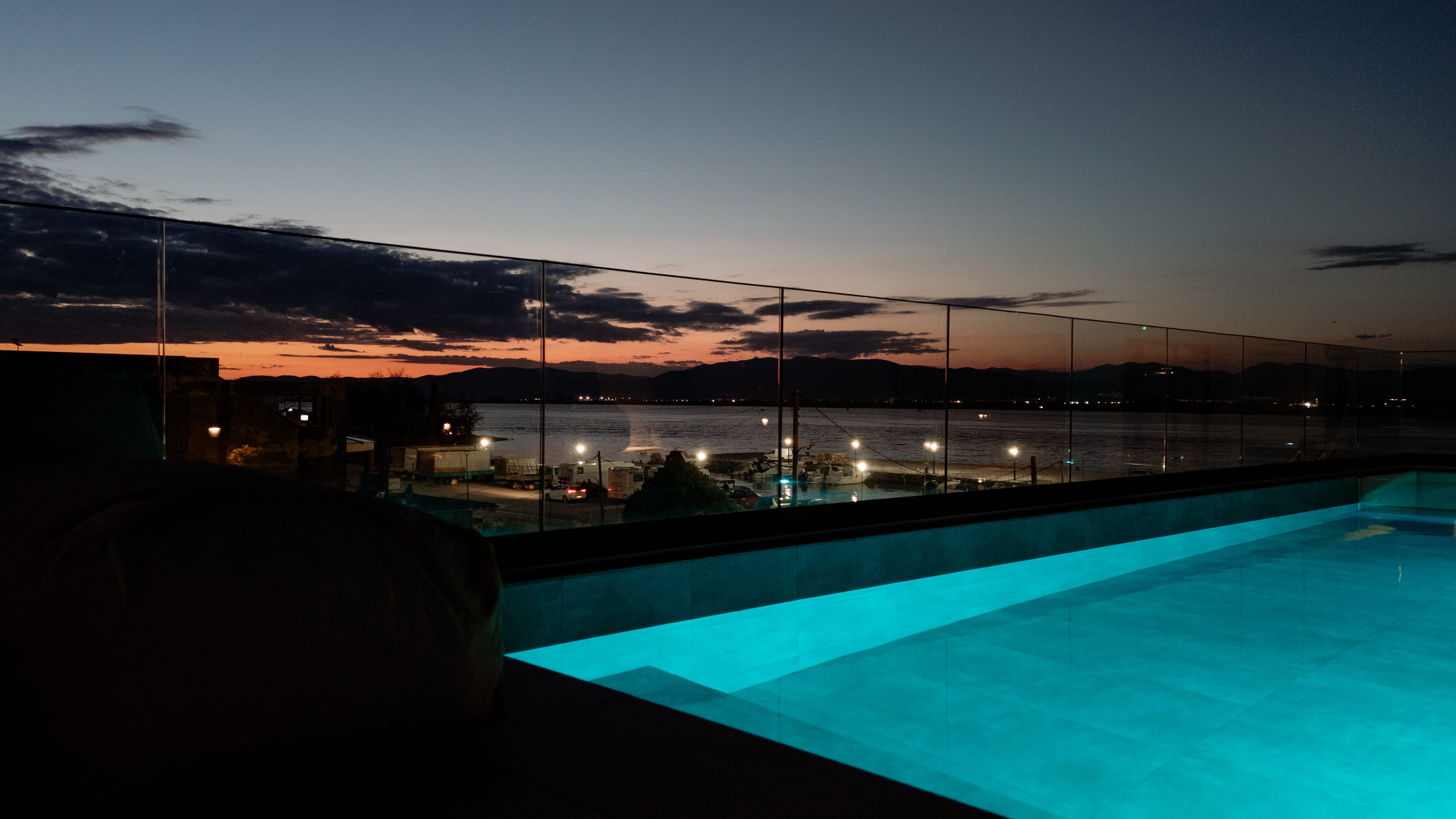 a pool with a city in the background