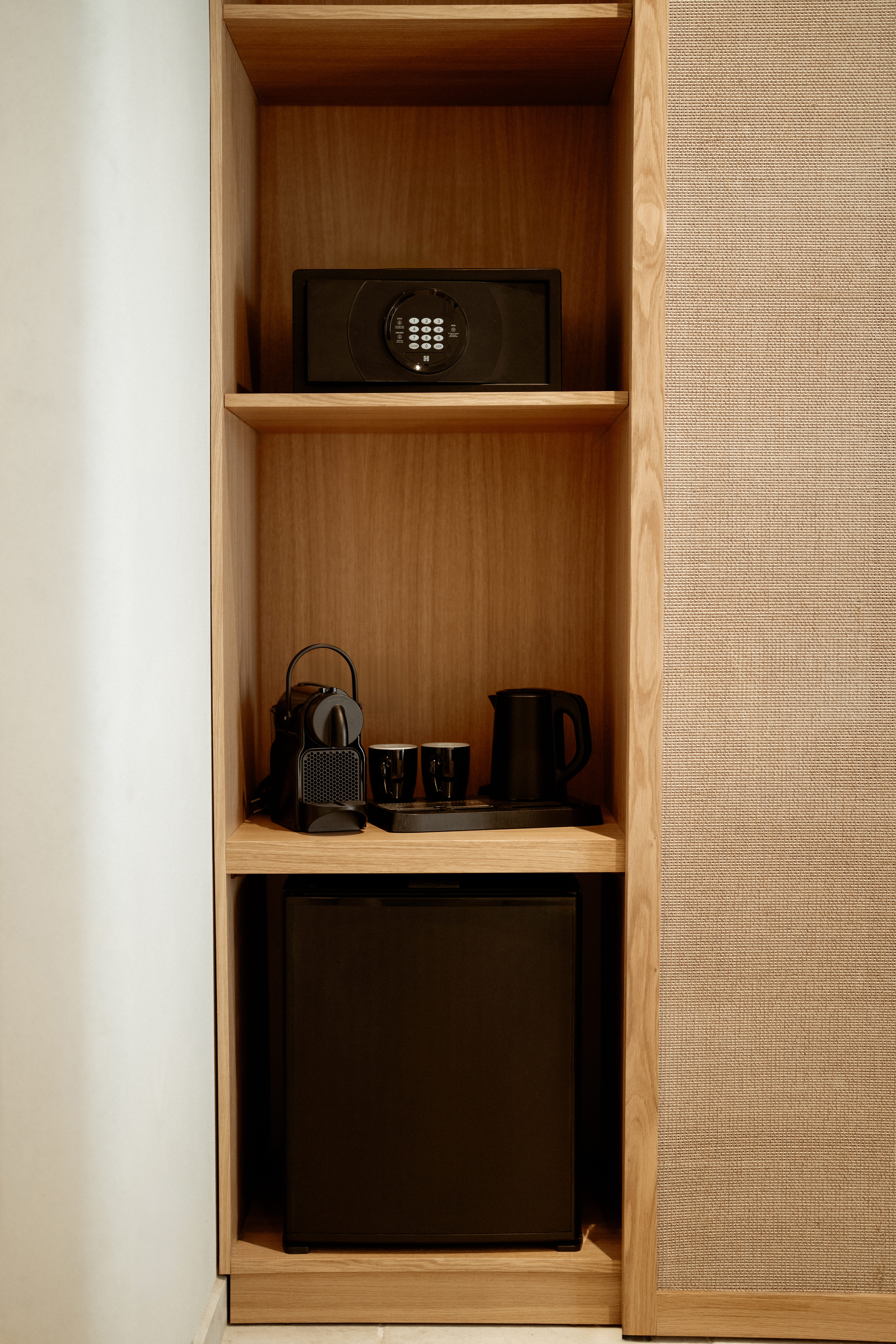 a shelf with a microwave and coffee maker on it