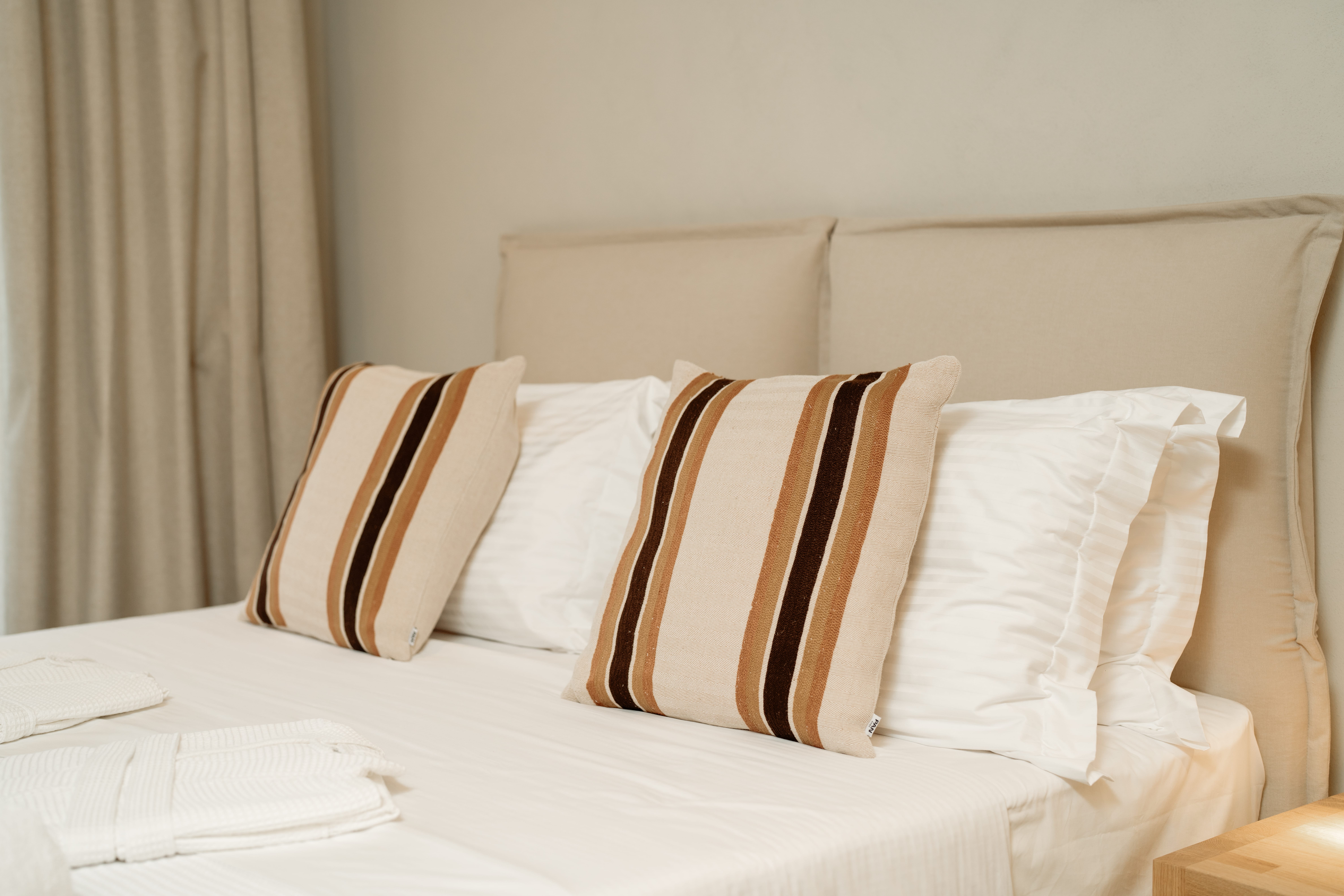 a bed with white pillows