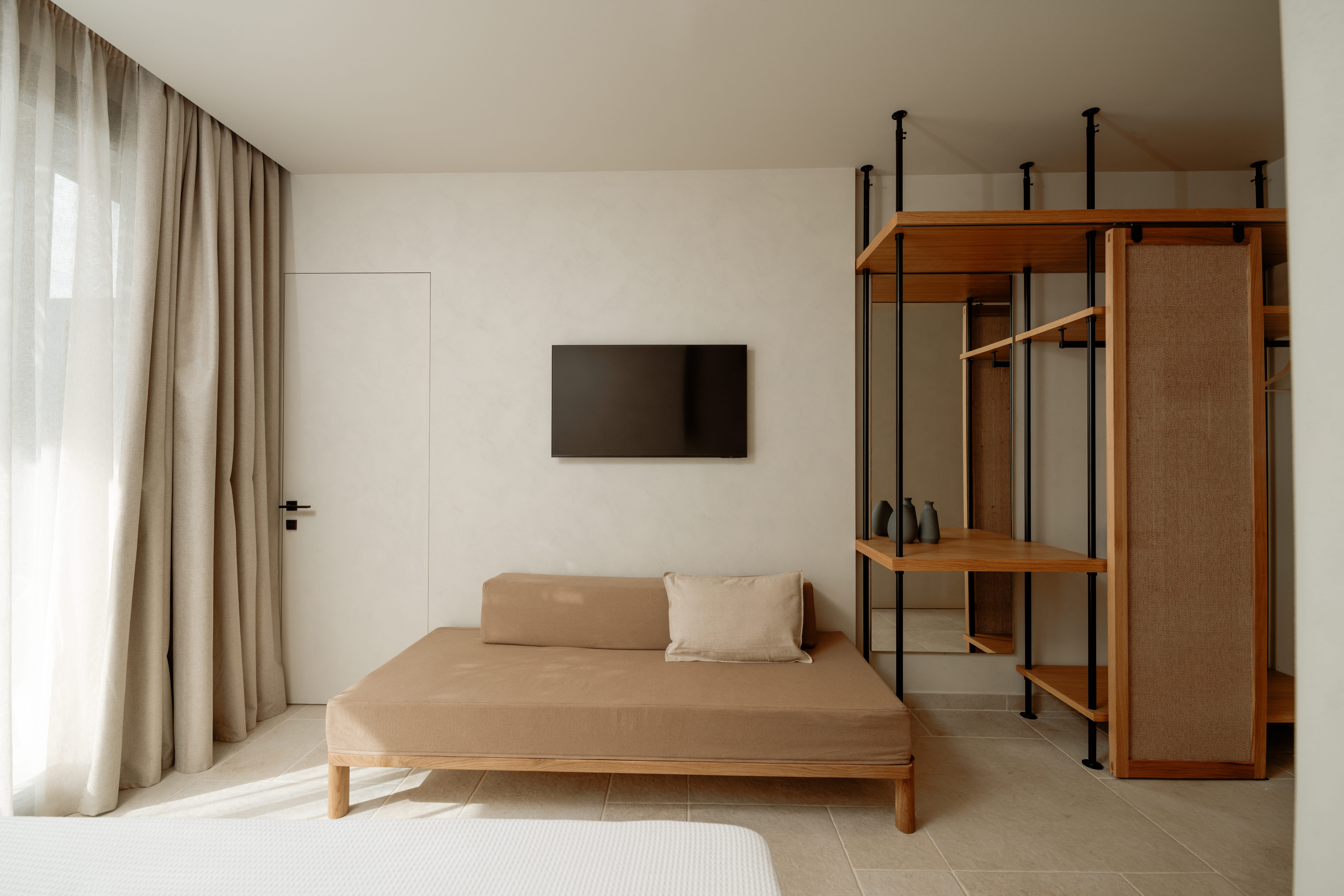 a room with a couch and a tv