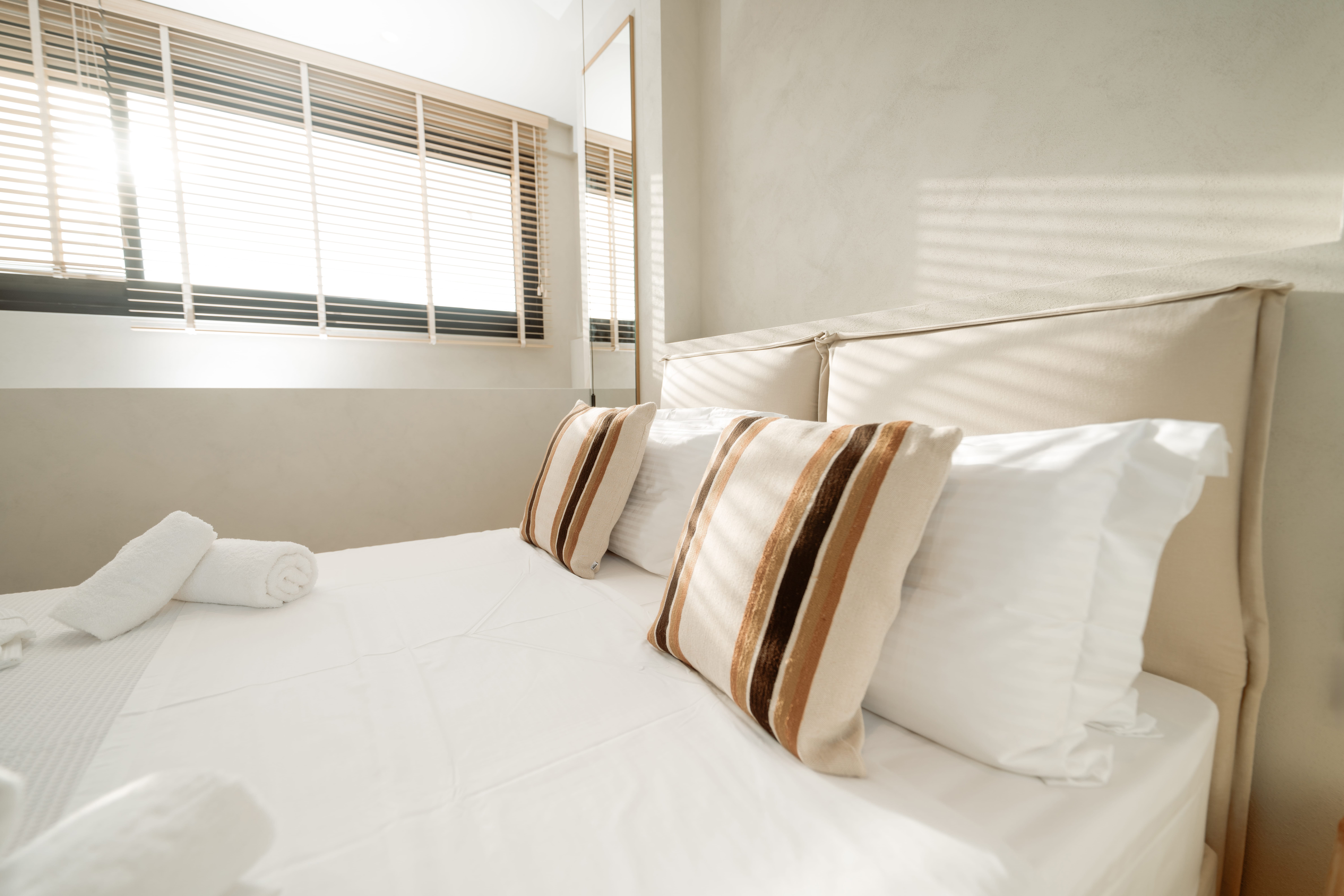 a bed with white sheets