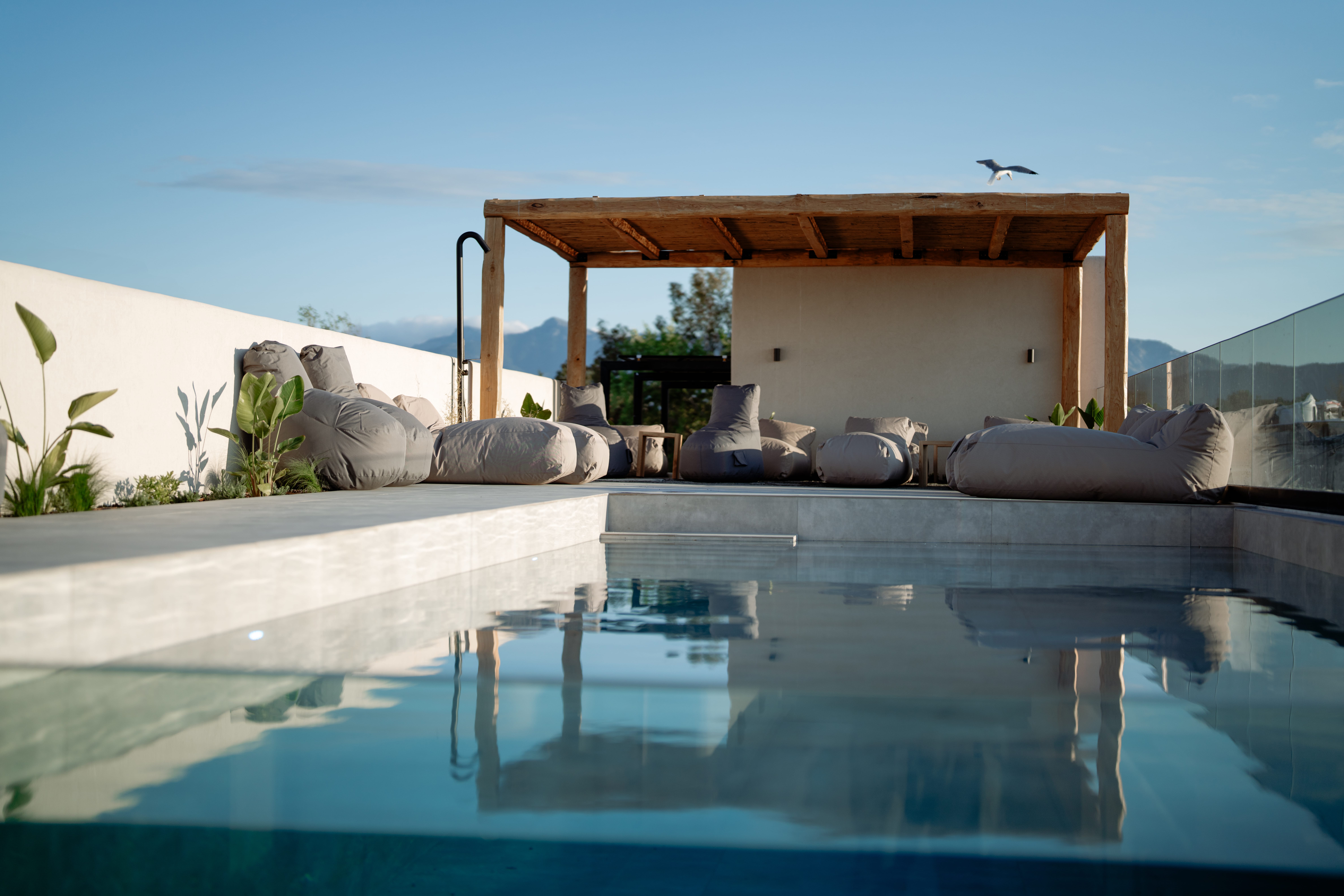 a pool with a house in the background