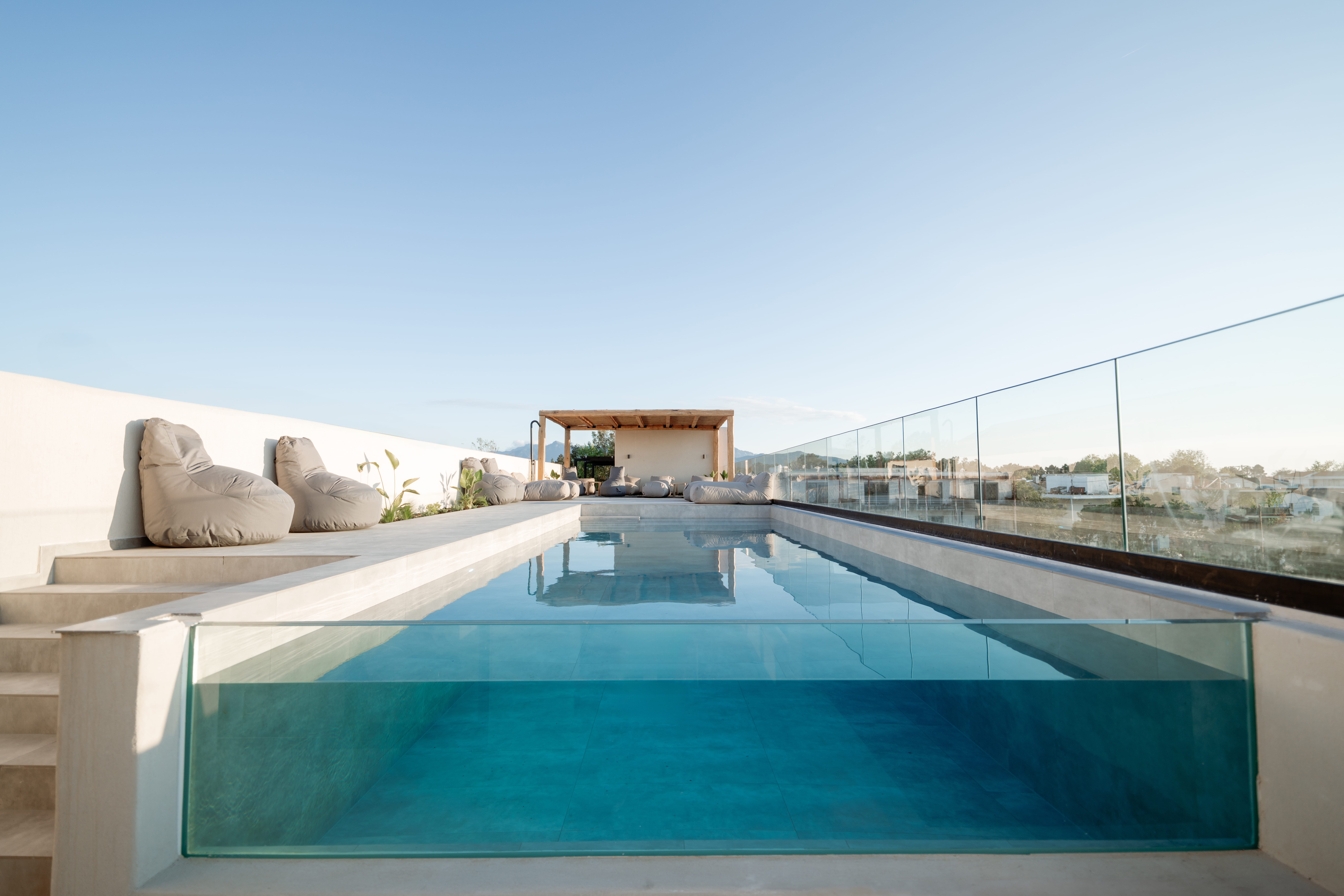 a swimming pool with a bridge in the background