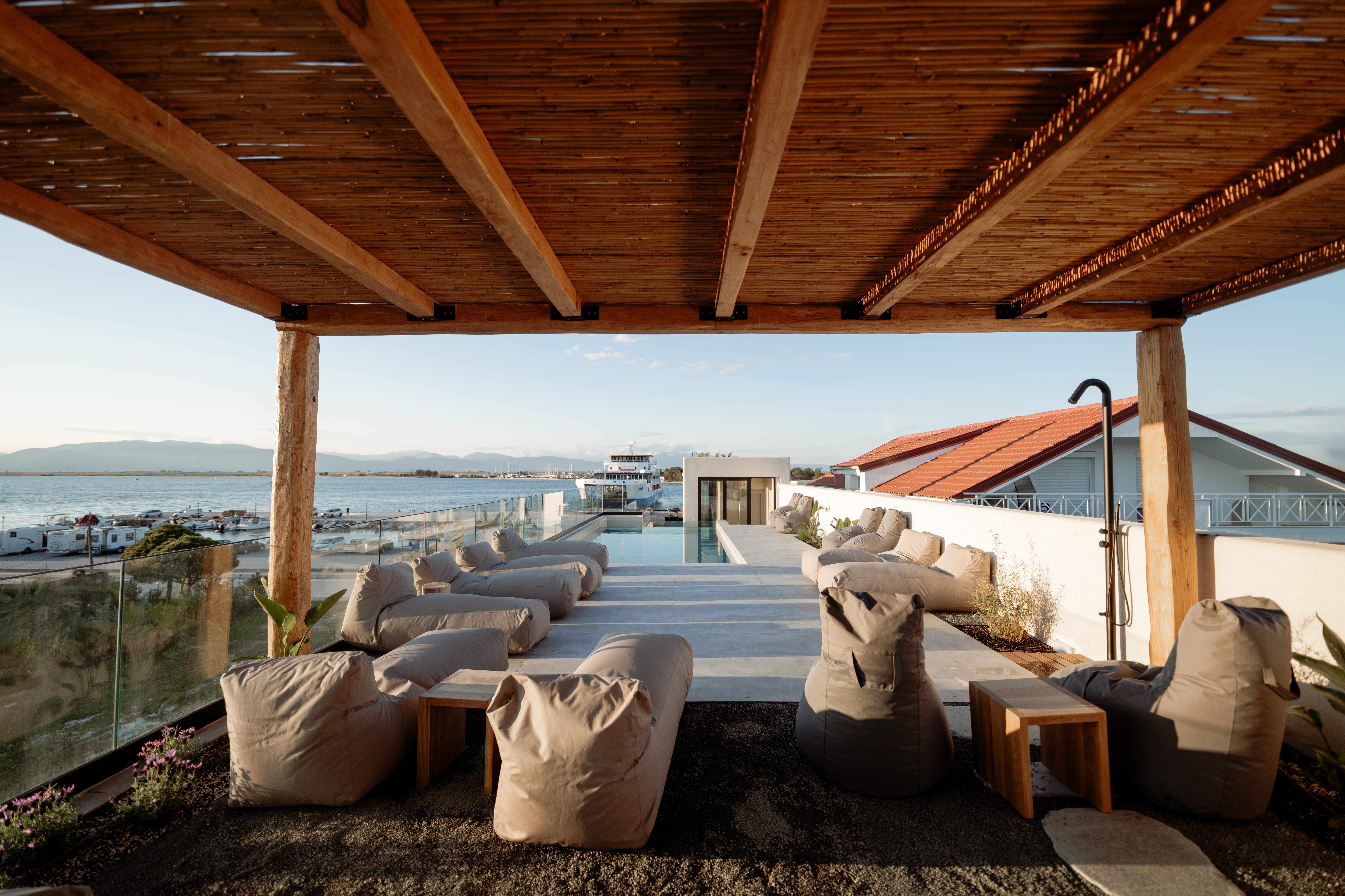 a room with a pool and chairs