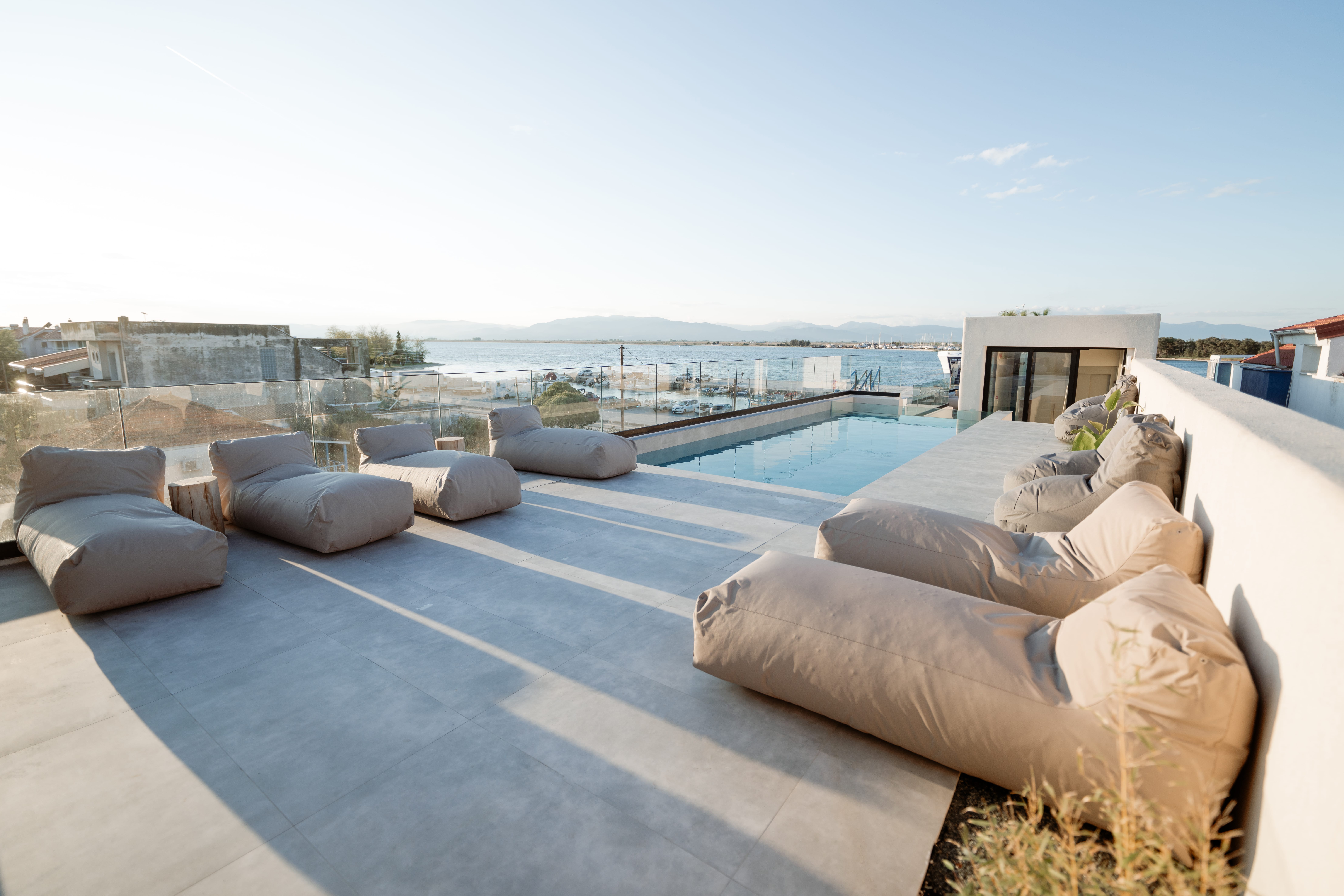 a pool with a deck and chairs