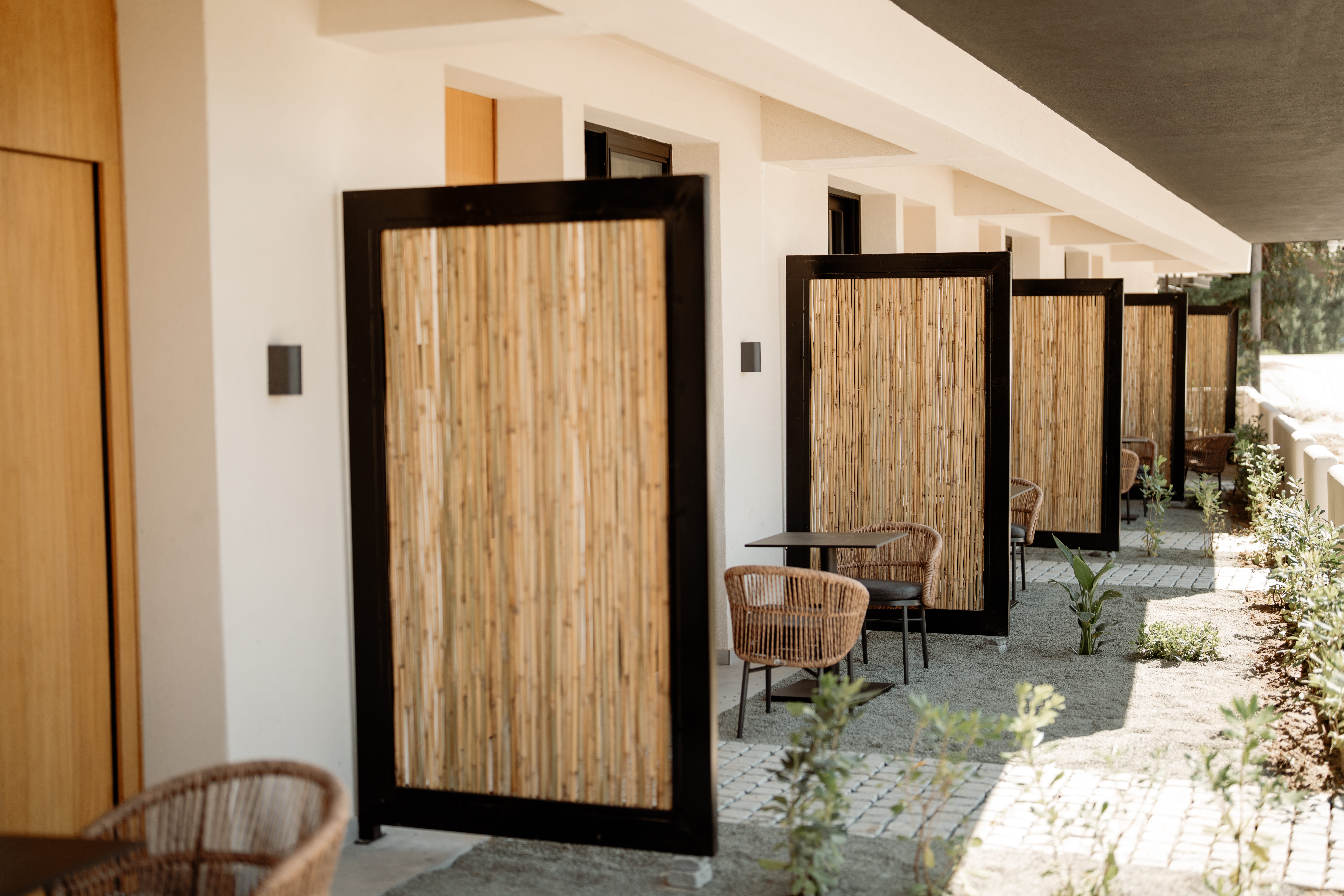 a room with a table chairs and a door