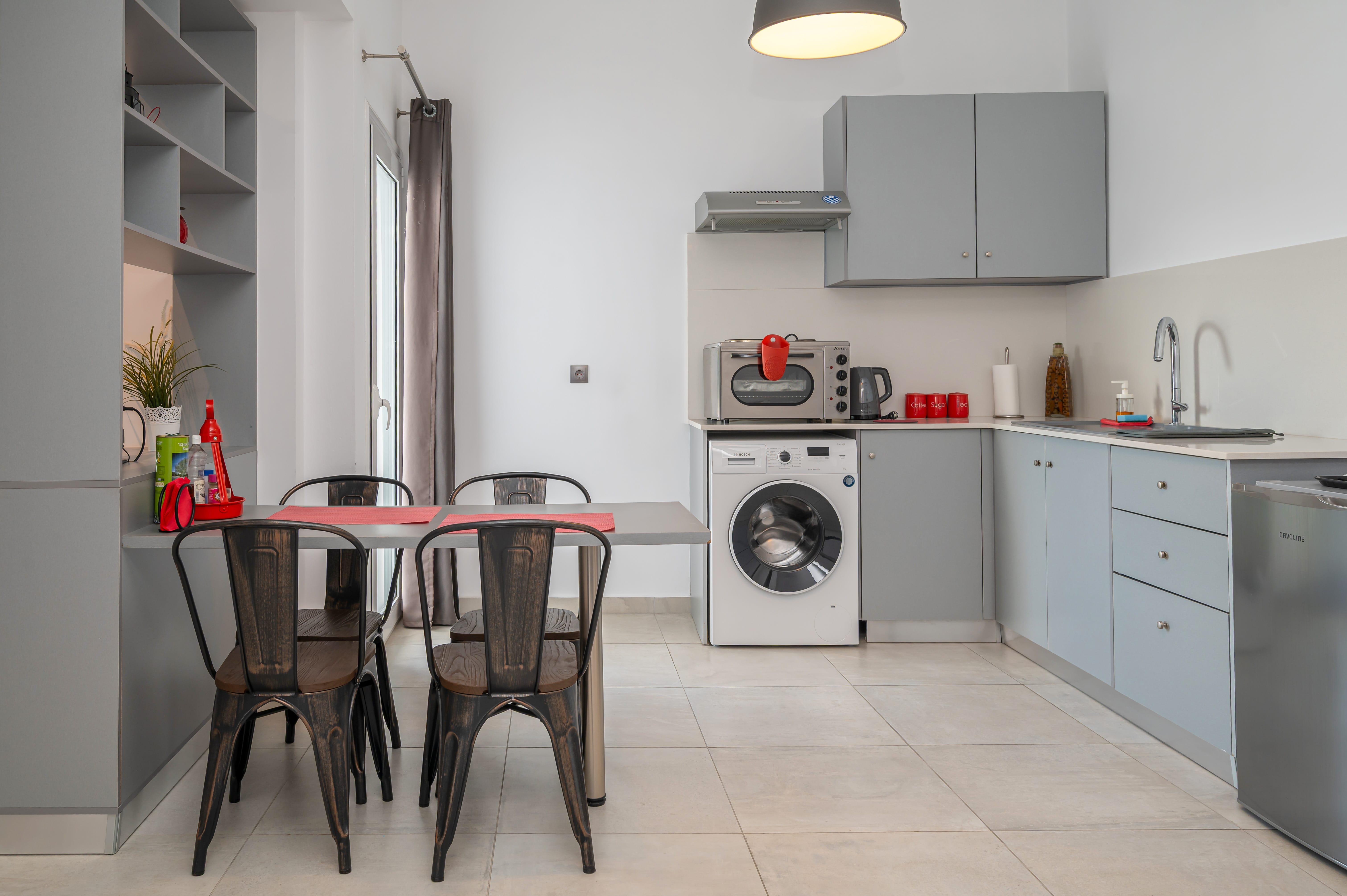a kitchen with a table and chairs