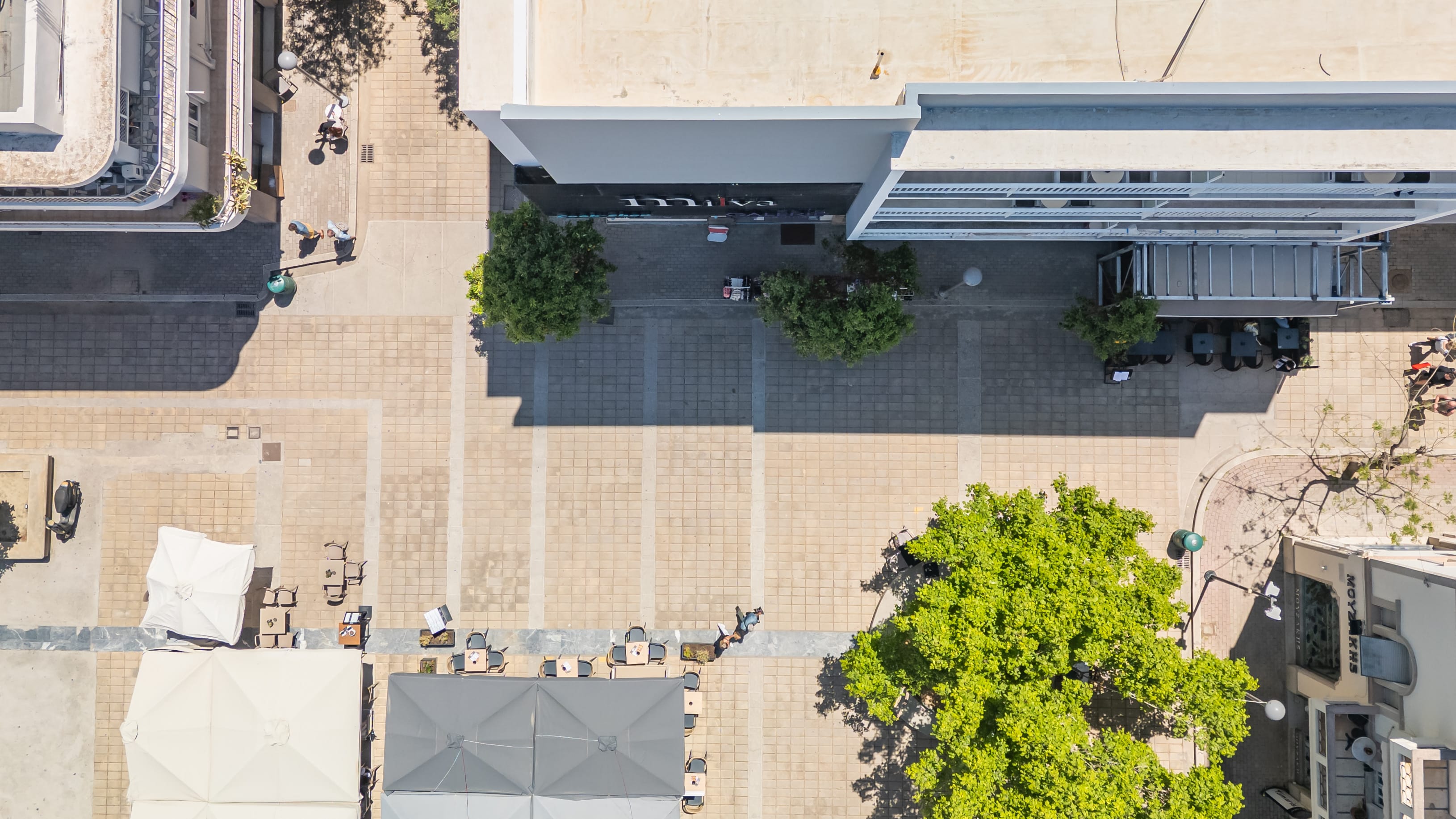 a building with trees and people