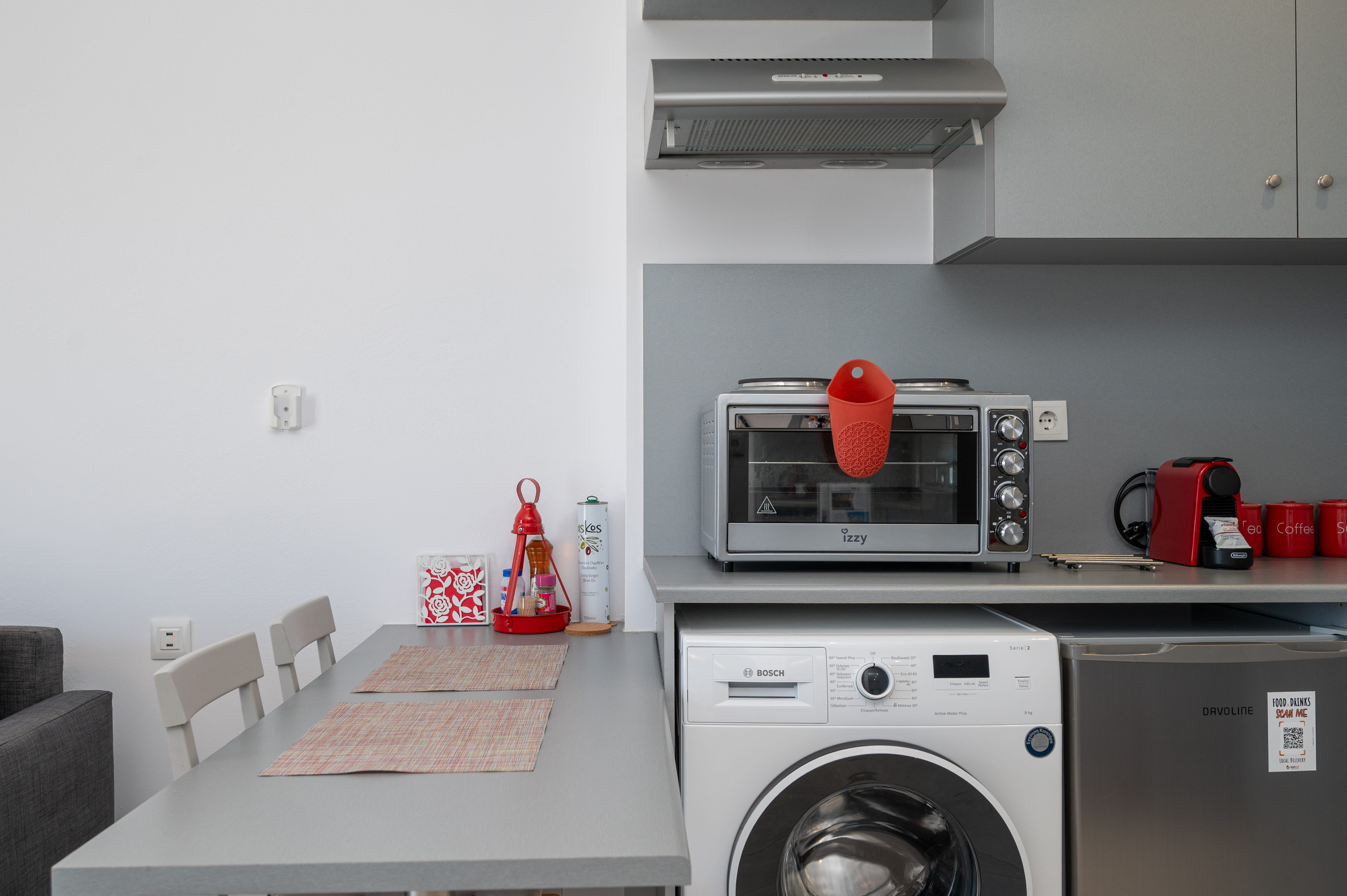 a kitchen with a table and a microwave