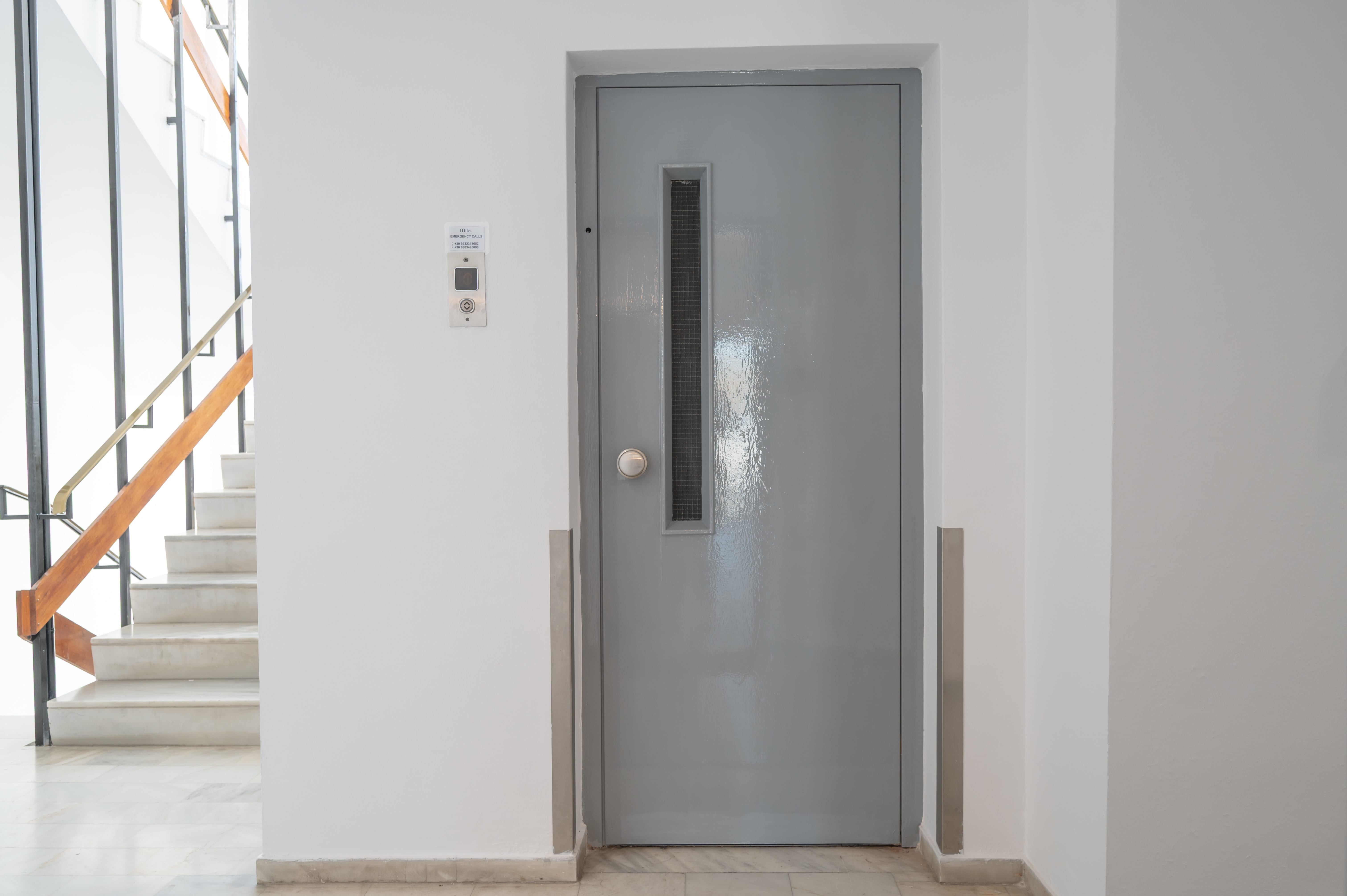 a grey door in a hallway