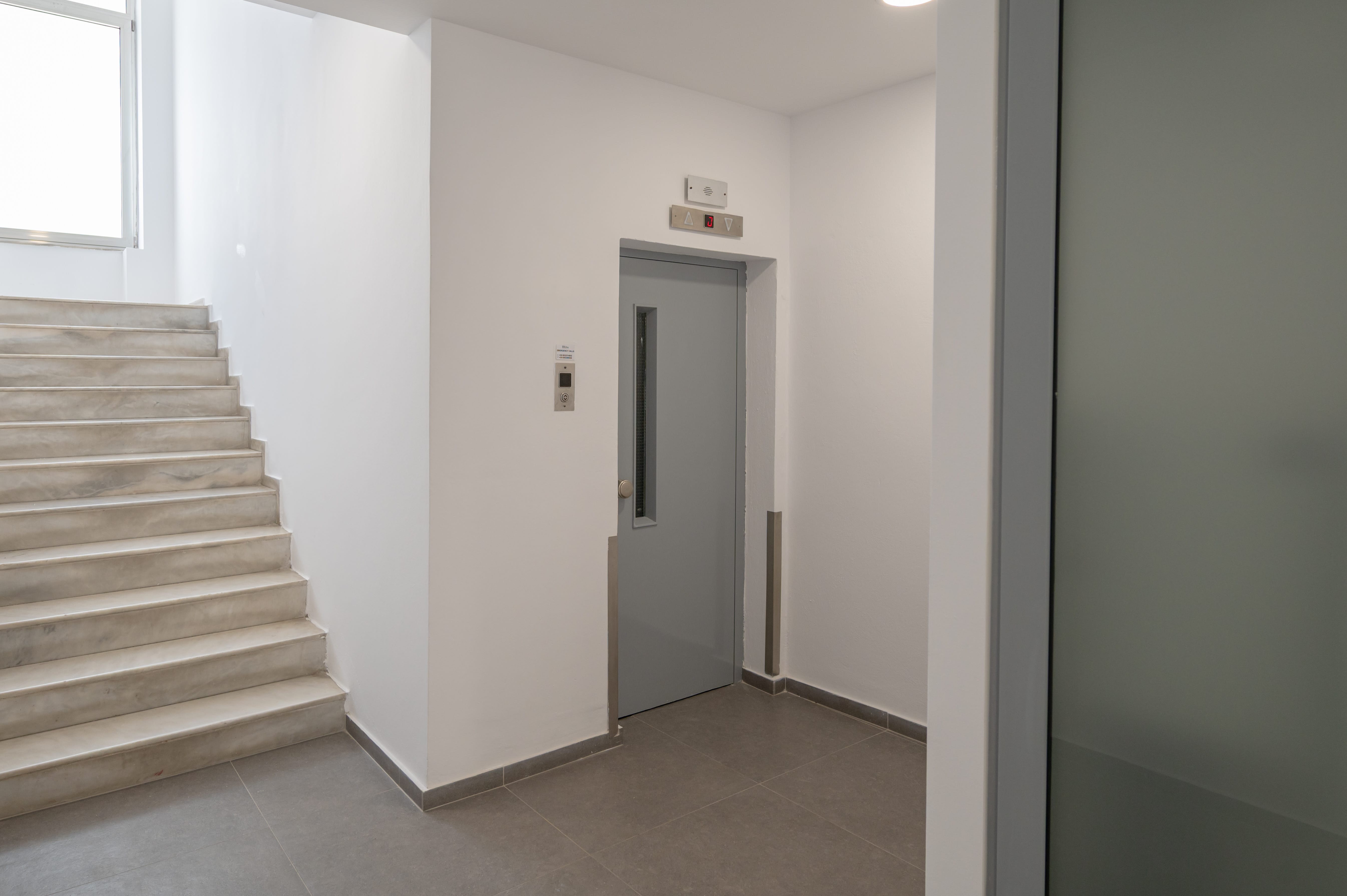 a door in a room with stairs